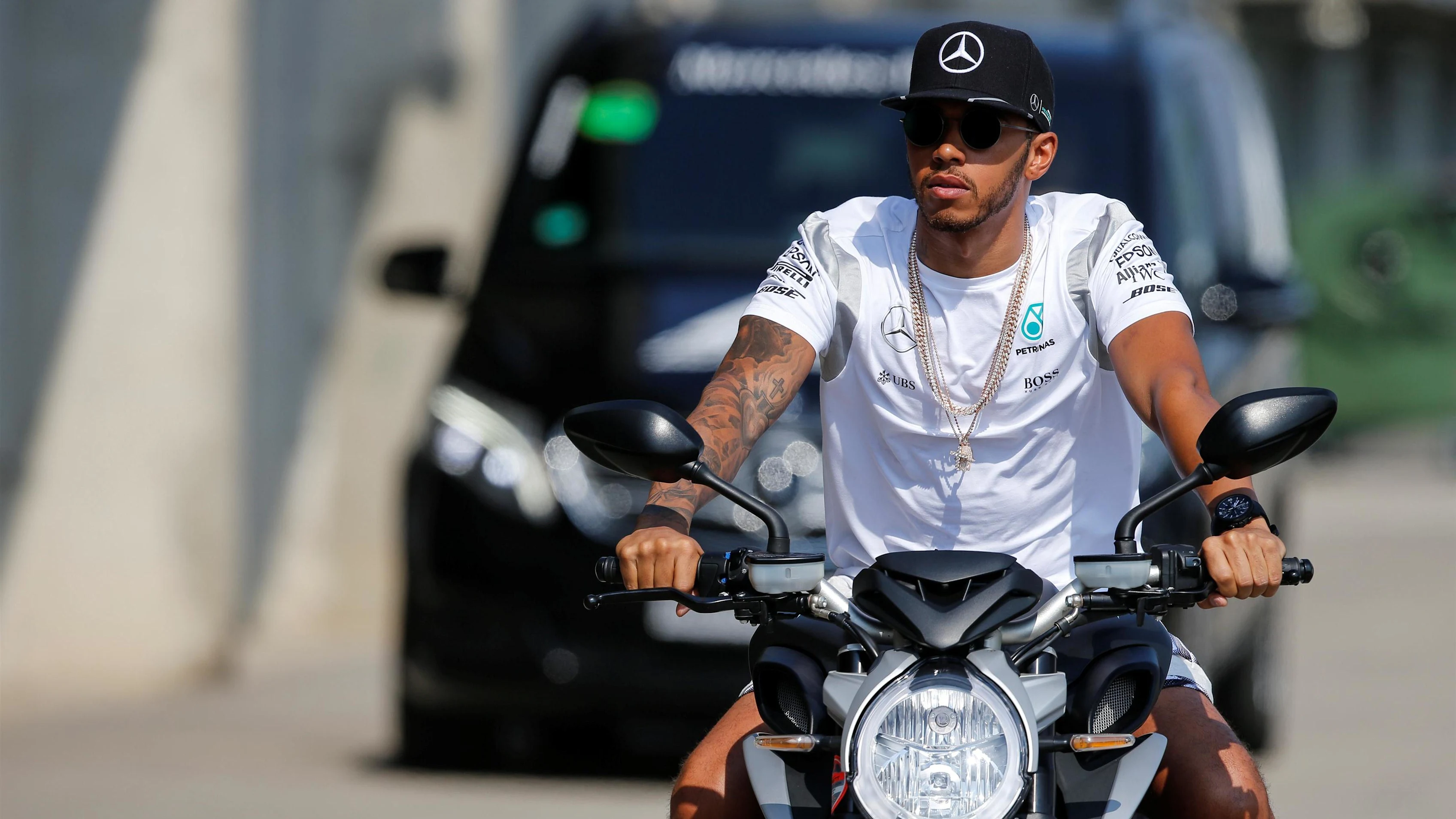 Lewis Hamilton (GBR) Mercedes AMG F1 arrives at the track on a motorbike at Formula One World Championship, Rd11, Qualifying, Hungaroring, Hungary, Saturday 23 July 2016. © Sutton Images