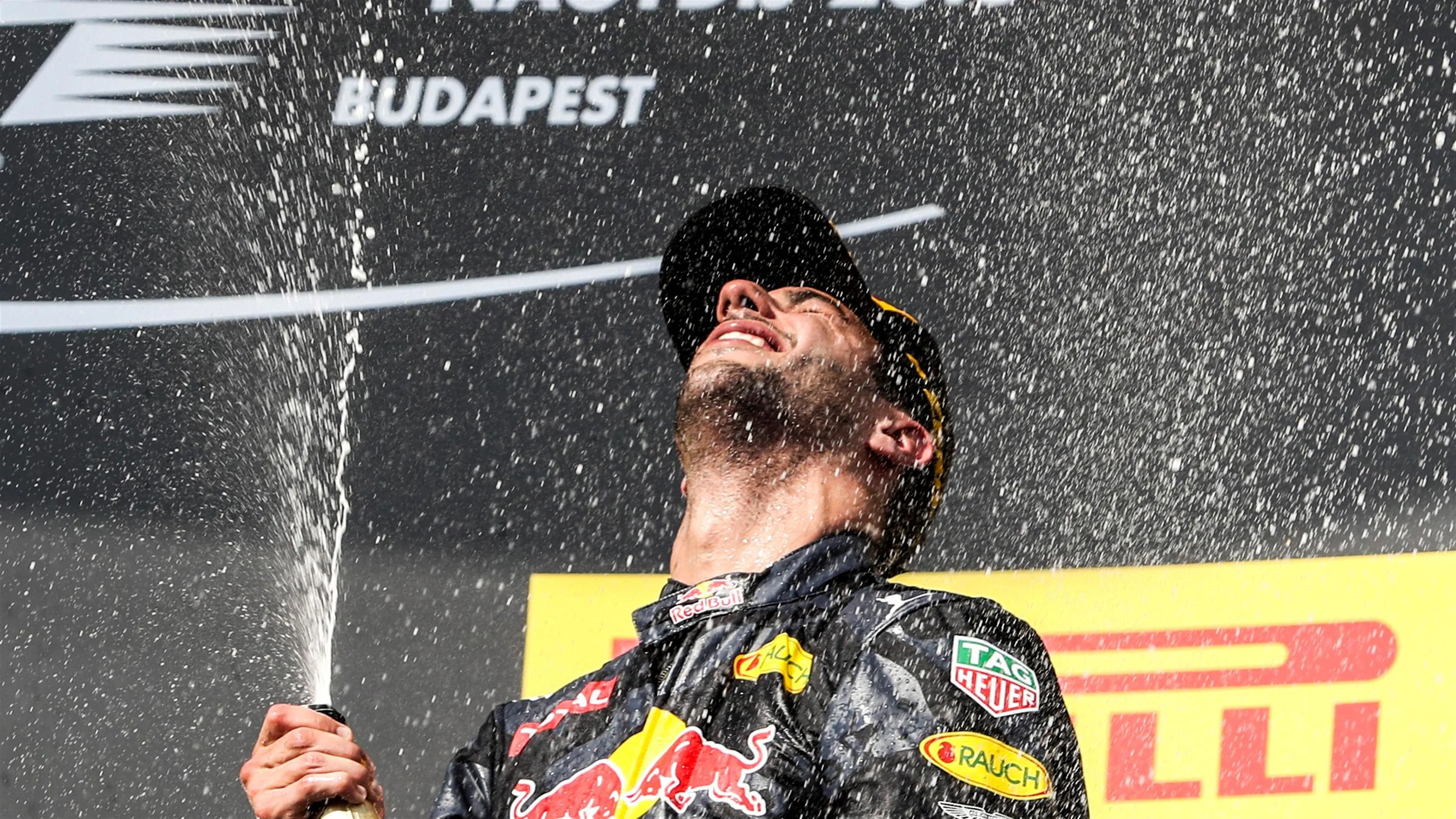 Daniel Ricciardo (AUS) Red Bull Racing celebrates on the podium with the champagne at Formula One