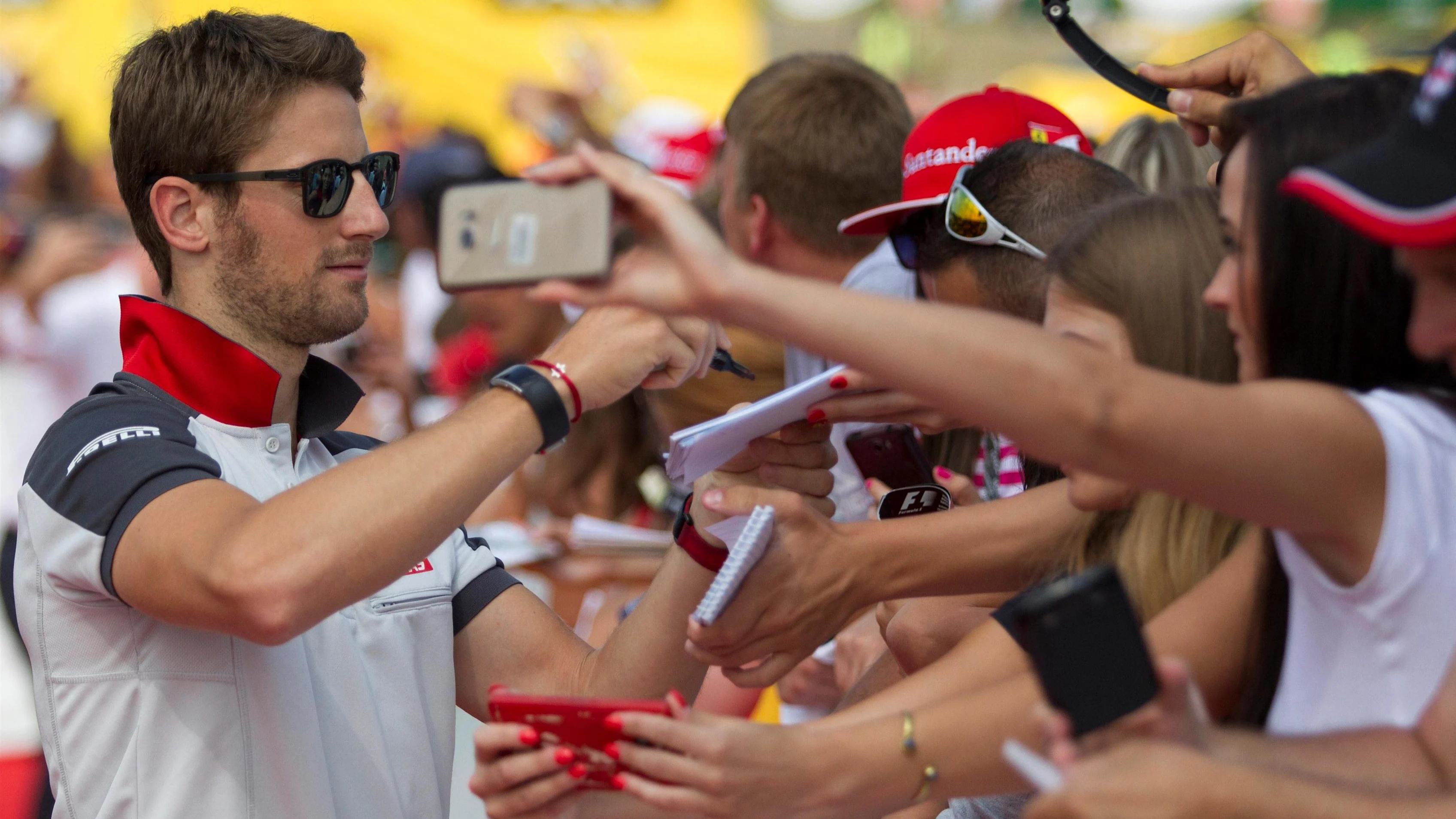 Romain Grosjean (FRA) Haas F1 signs autographs for the fans at Formula One World Championship, Rd11, Hungarian Grand Prix, Race, Hungaroring, Hungary, Sunday 24 July 2016. © Sutton Images