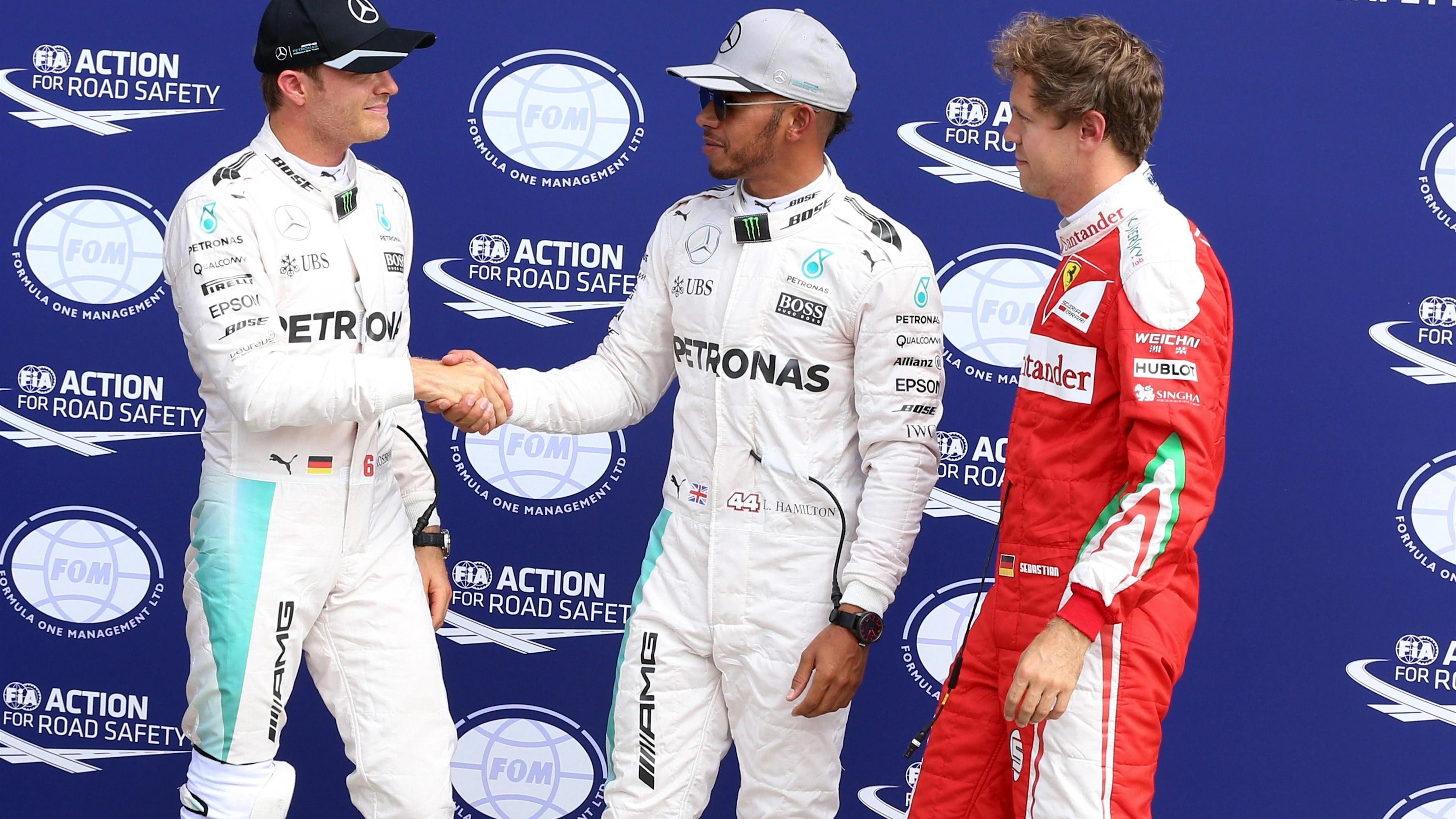 Nico Rosberg (GER) Mercedes AMG F1, Lewis Hamilton (GBR) Mercedes AMG F1 and Sebastian Vettel (GER) Ferrari in parc ferme at Formula One World Championship, Rd14, Italian Grand Prix, Qualifying, Monza, Italy, Saturday 3 September 2016. © Sutton Images