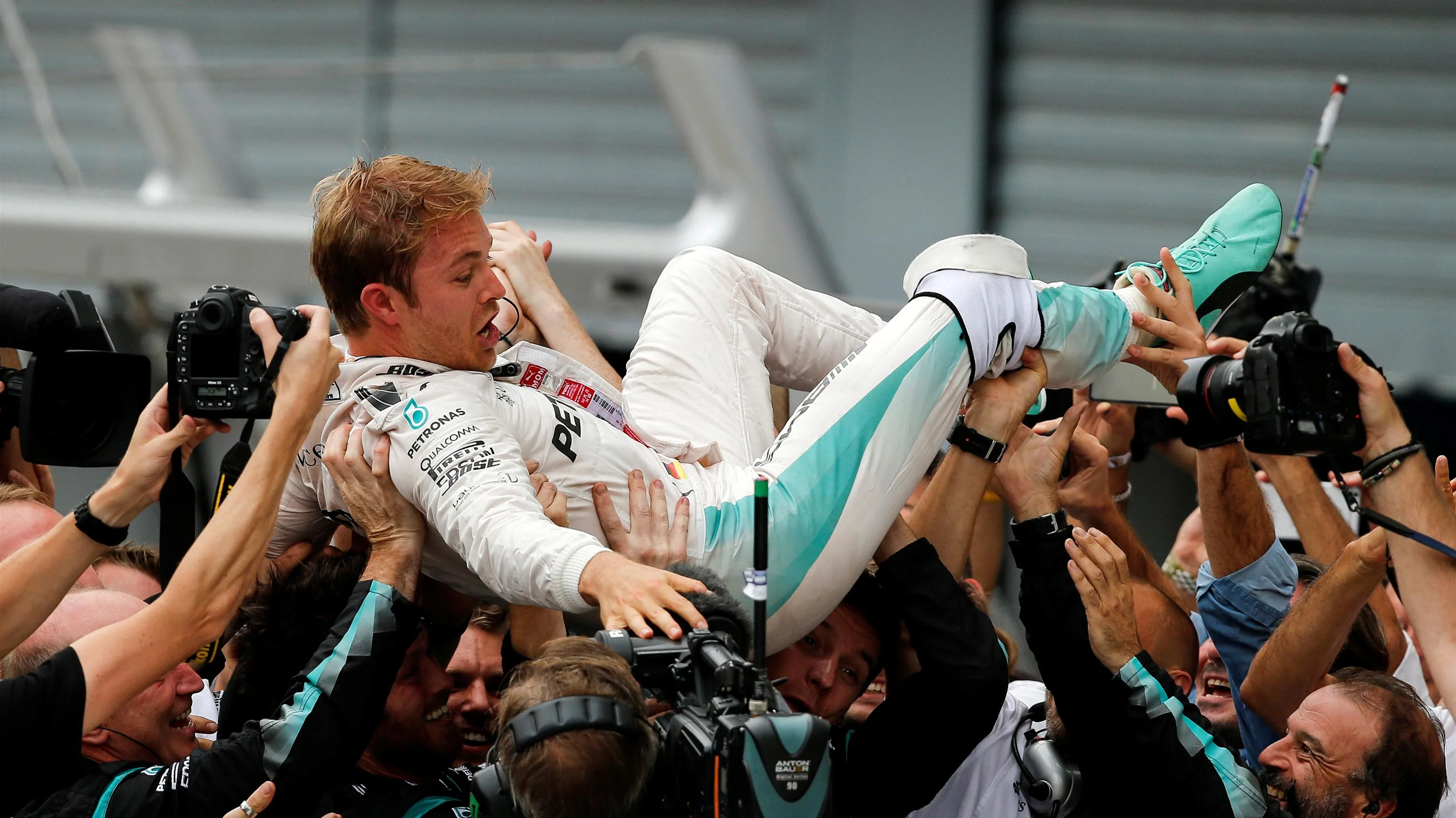 Race winner Nico Rosberg (GER) Mercedes AMG F1 celebrates in Parc ferme with the team at Formula