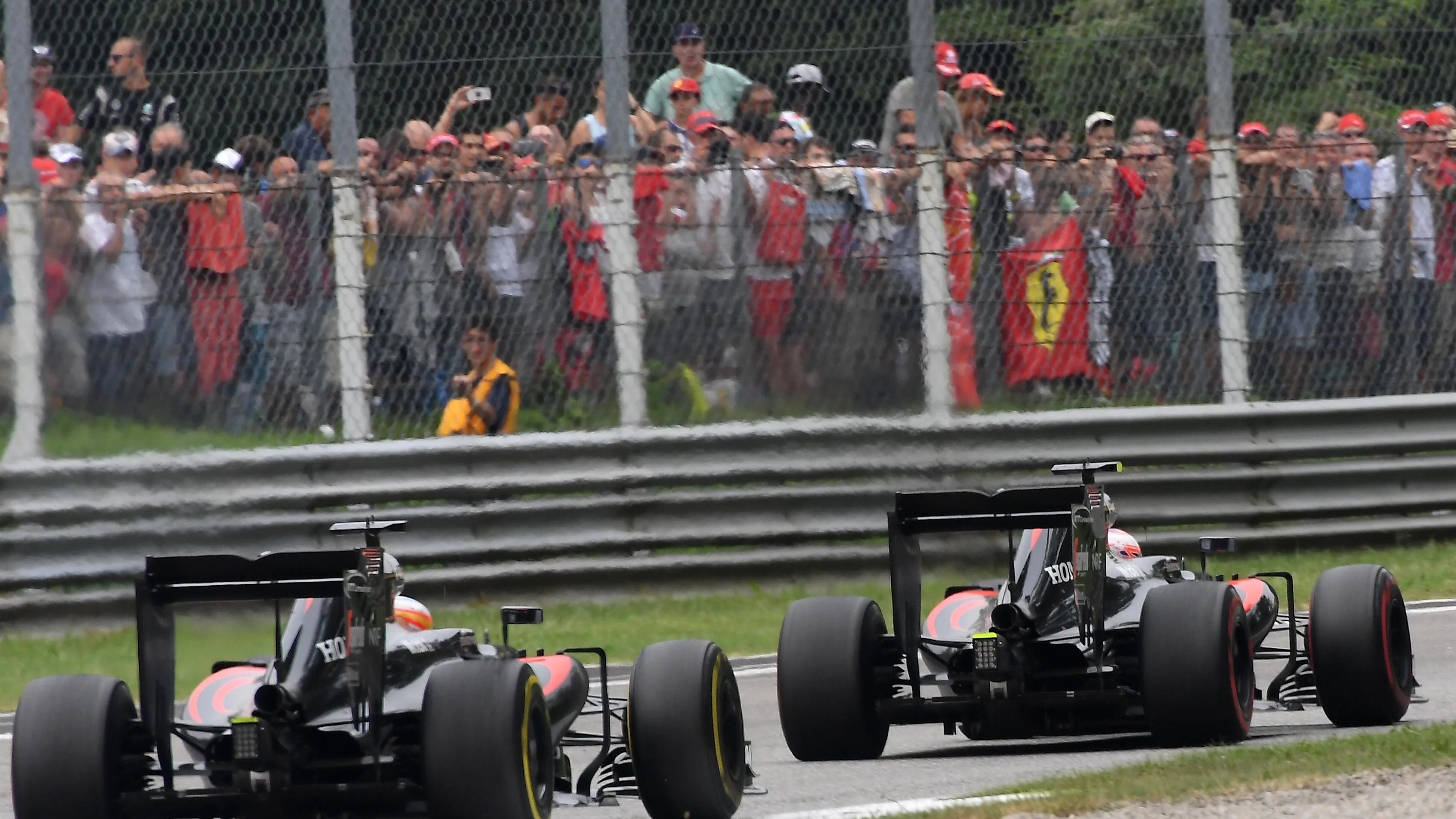 Jenson Button (GBR) McLaren MP4-31 leads Fernando Alonso (ESP) McLaren MP4-31 at Formula One World