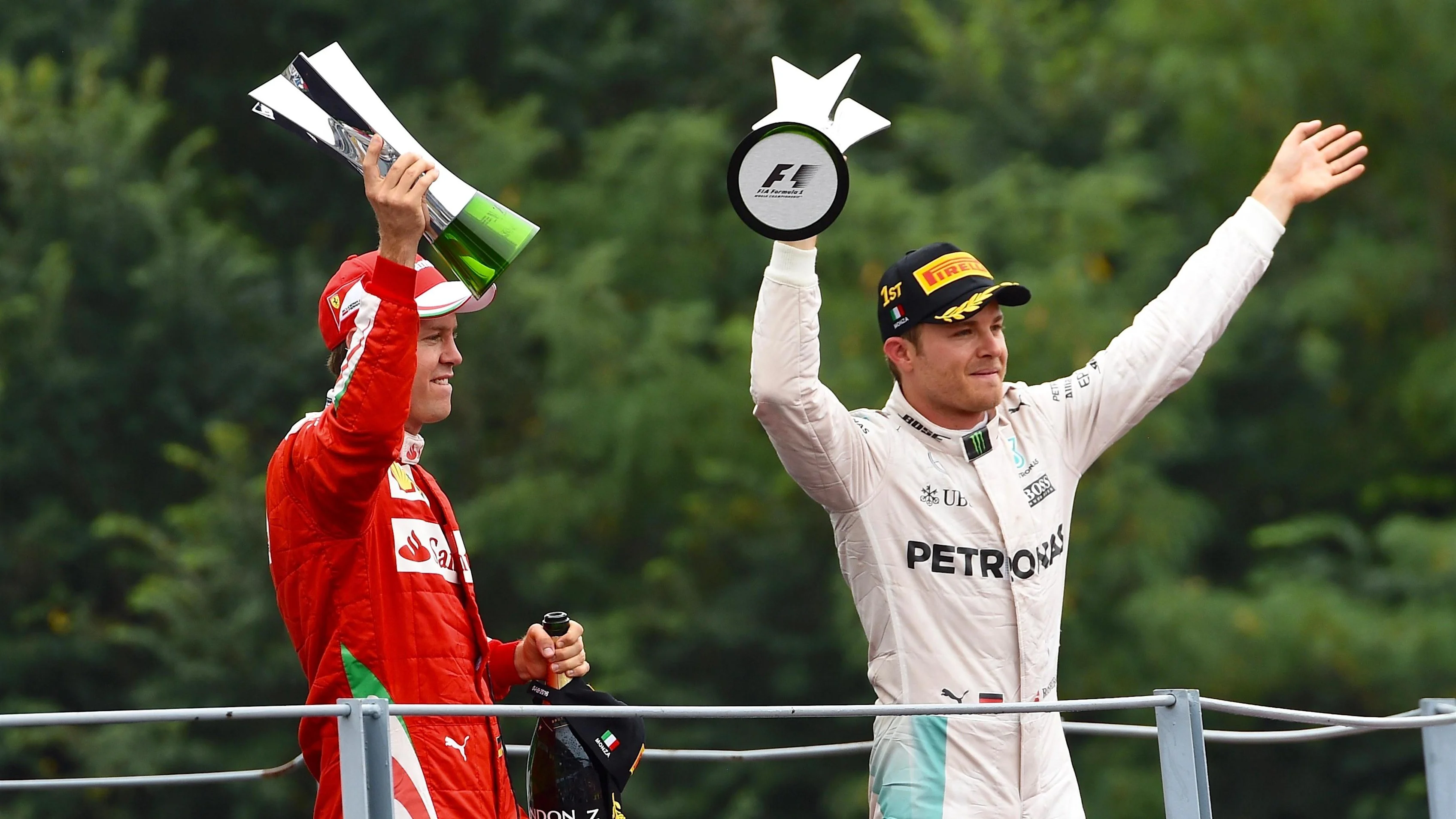 Sebastian Vettel (GER) Ferrari and Nico Rosberg (GER) Mercedes AMG F1 celebrate on the podium with