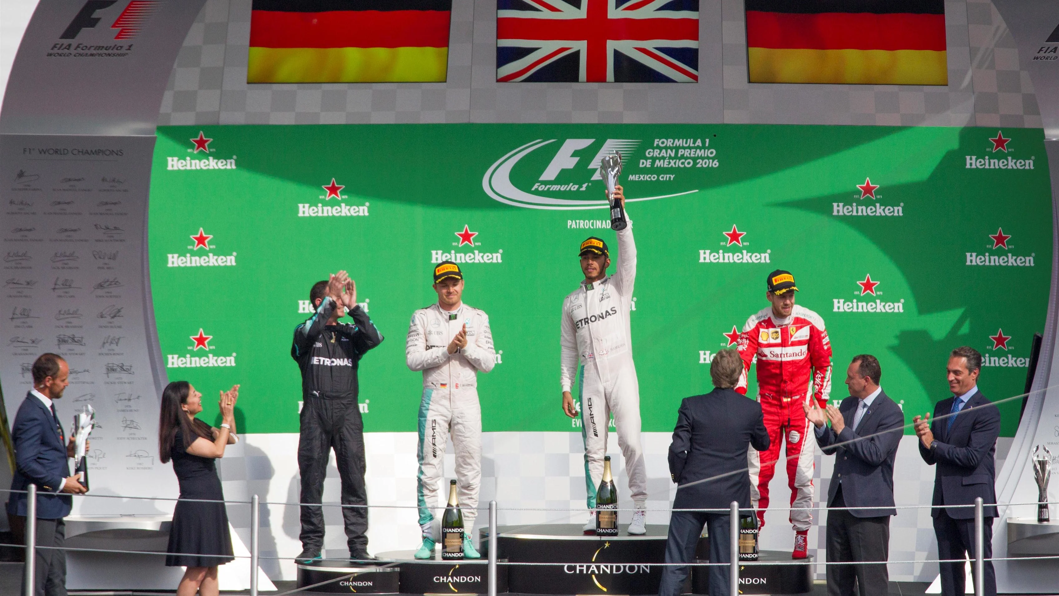 Nico Rosberg (GER) Mercedes AMG F1, Tom Walton (GBR) Mercedes AMG F1 Engineer, Lewis Hamilton (GBR) Mercedes AMG F1 and Sebastian Vettel (GER) Ferrari celebrate on the podium with the trophy at Formula One World Championship, Rd19, Mexican Grand Prix, Race, Circuit Hermanos Rodriguez, Mexico City, Mexico, Sunday 30 October 2016. © Sutton Images