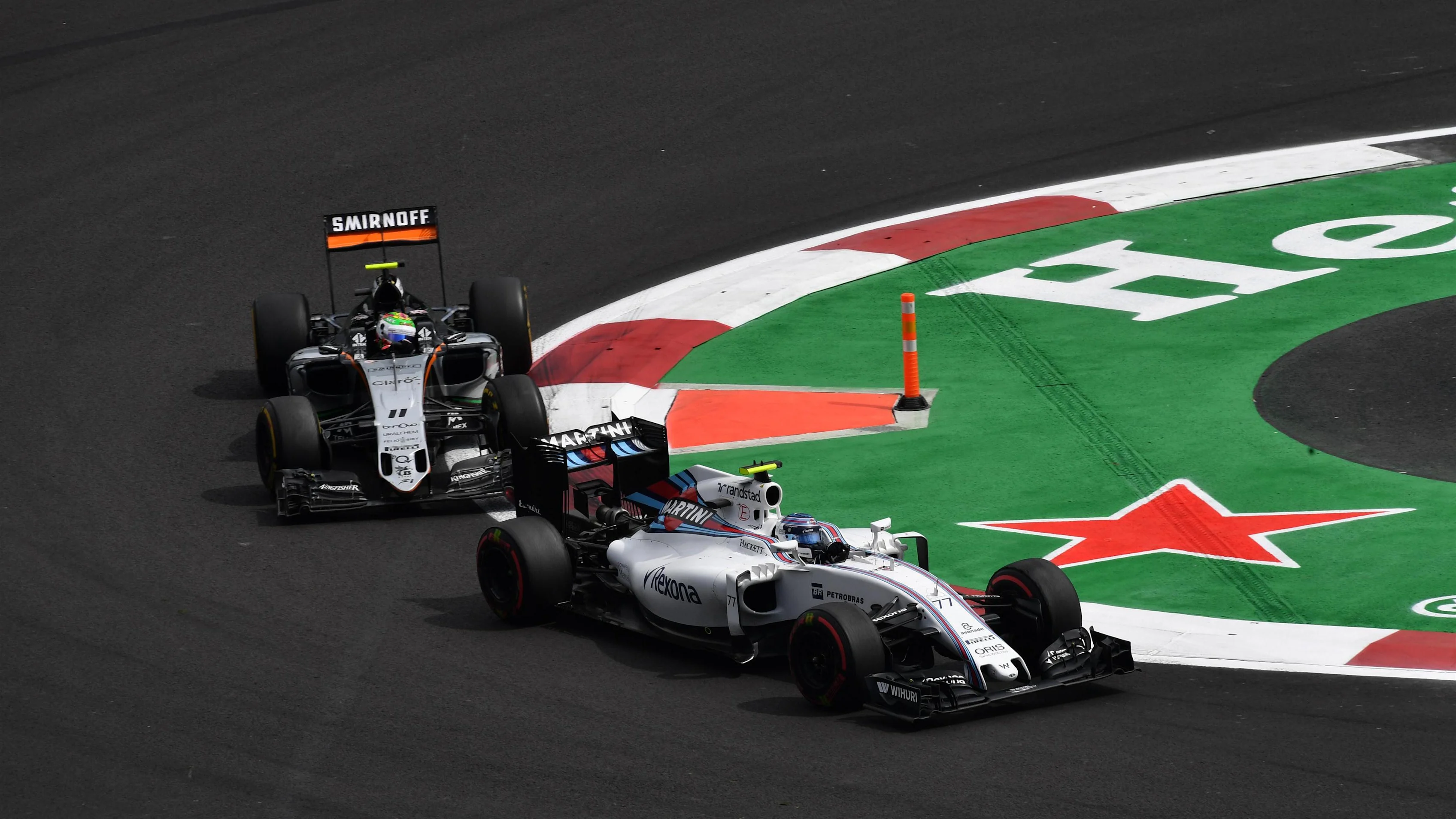 Valtteri Bottas (FIN) Williams FW38 leads Sergio Perez (MEX) Force India VJM09 at Formula One World