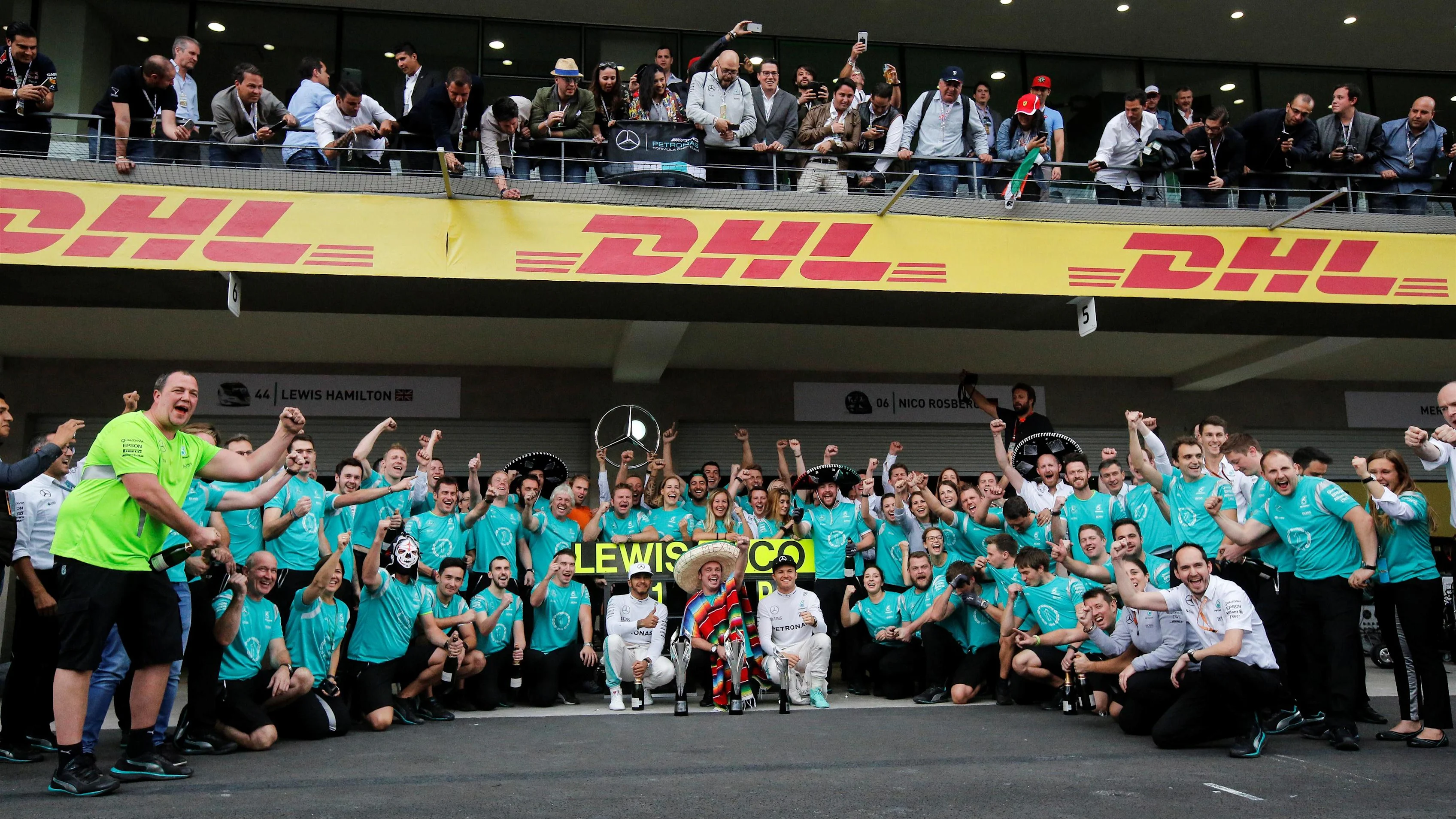 Lewis Hamilton (GBR) Mercedes AMG F1 and Nico Rosberg (GER) Mercedes AMG F1 celebrate with the team