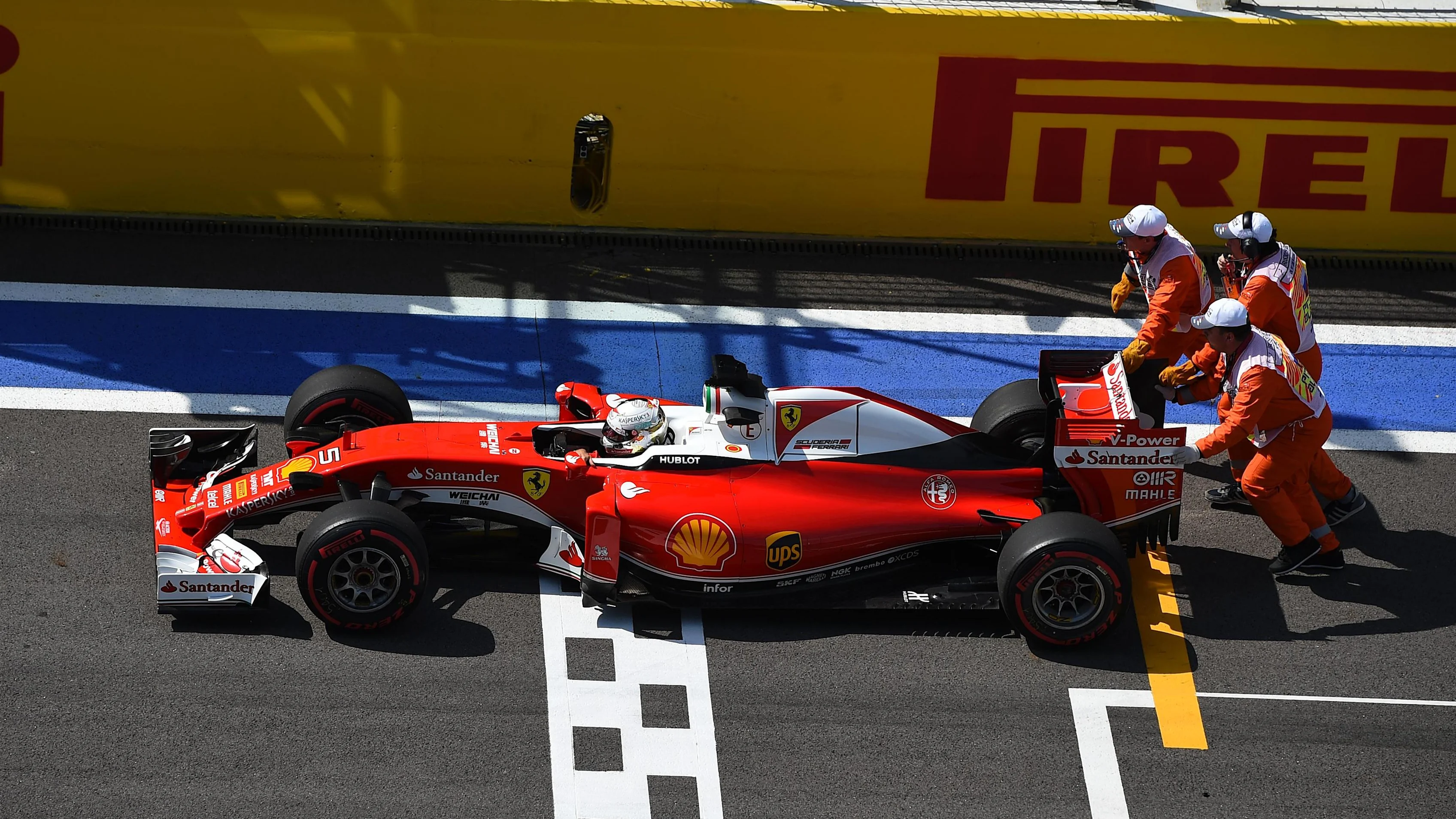 The car of Sebastian Vettel (GER) Ferrari SF16-H is pushed by the marshals in FP2 at Formula One World Championship, Rd4, Russian Grand Prix, Practice, Sochi Autodrom, Sochi, Krasnodar Krai, Russia, Friday 29 April 2016. © Sutton Motorsport Images