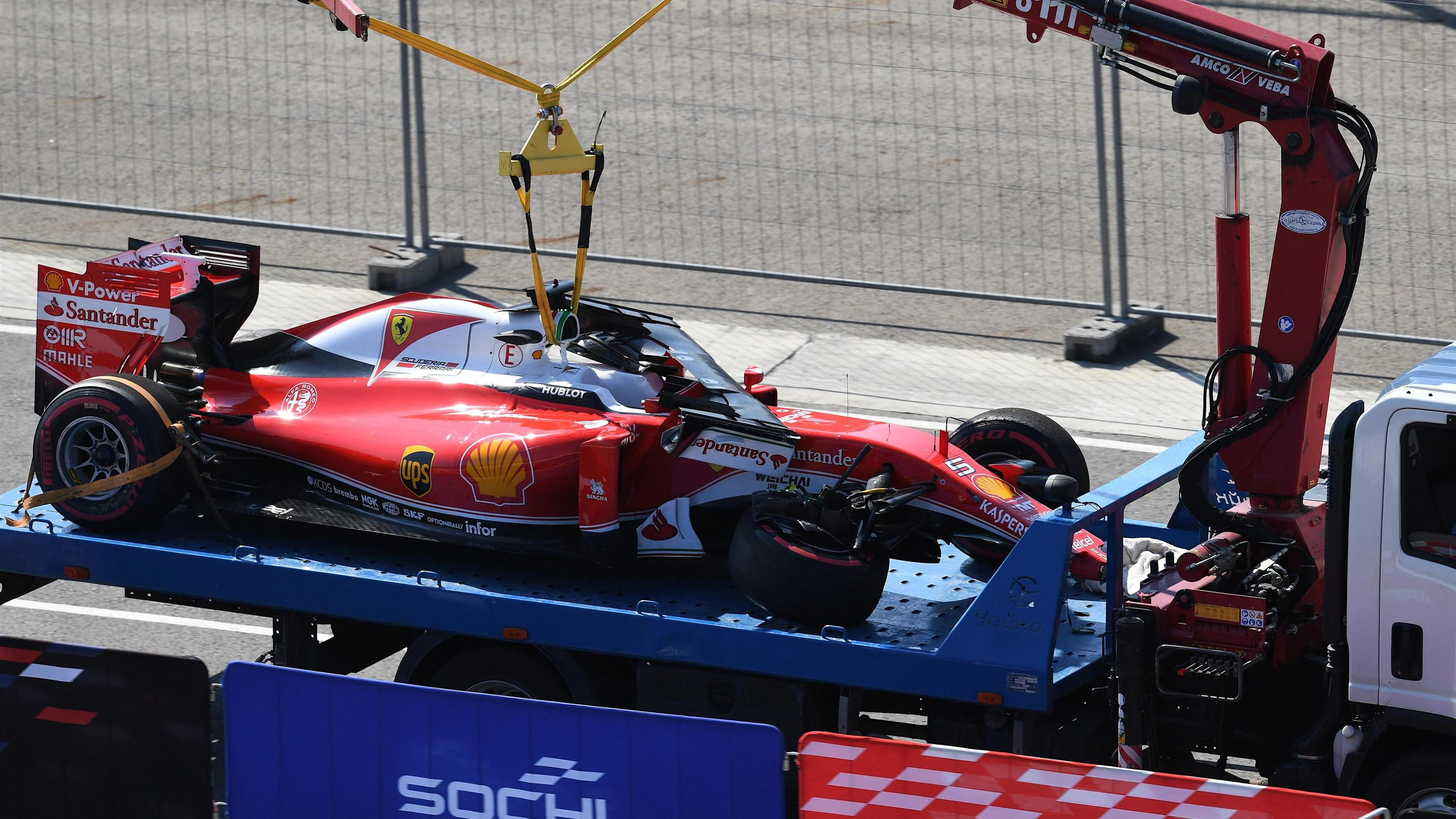 The crashed car of race retiree Sebastian Vettel (GER) Ferrari SF16-H is recovered at Formula One