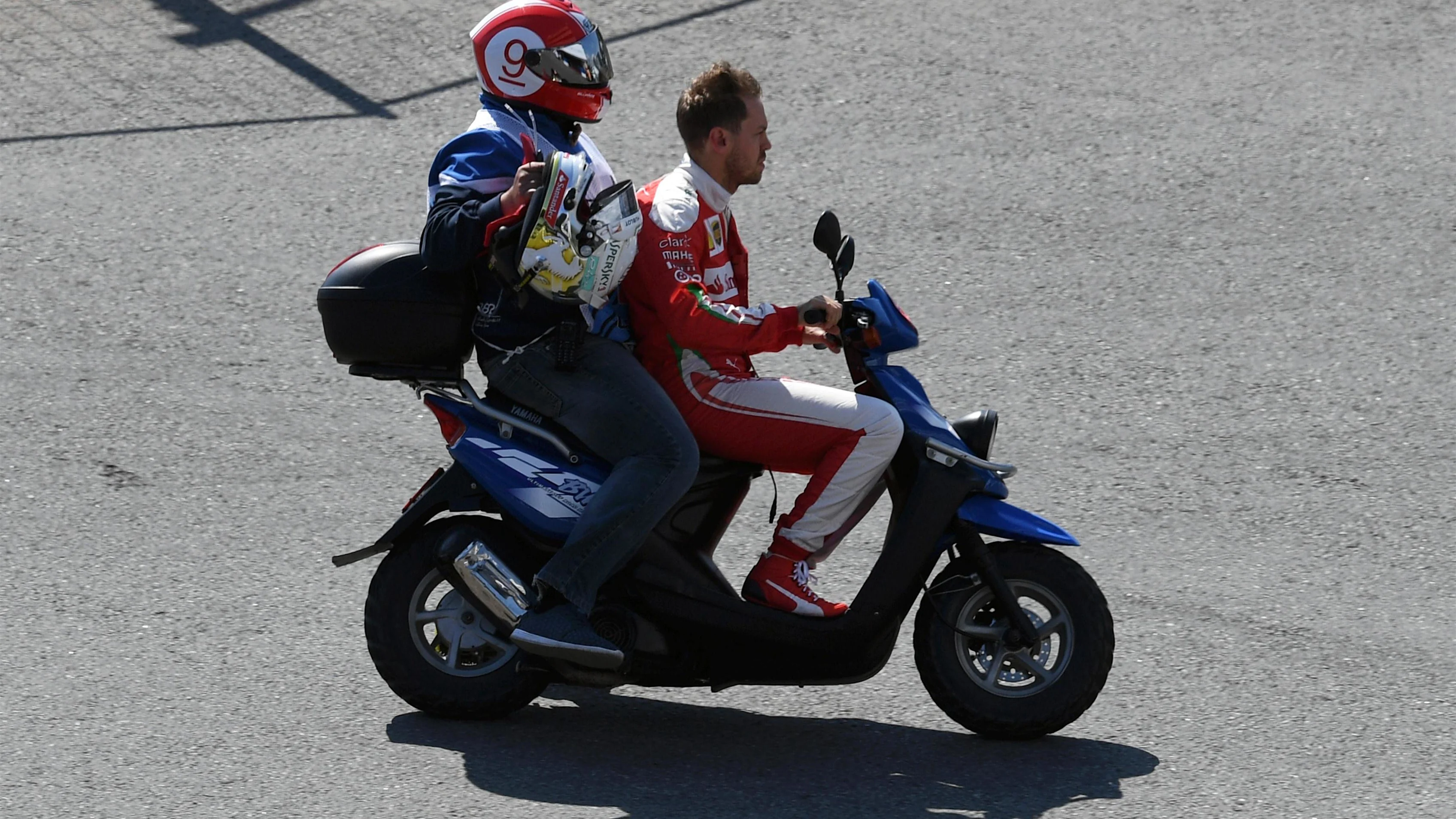 Race retiree Sebastian Vettel (GER) Ferrari on a scooter at Formula One World Championship, Rd4,
