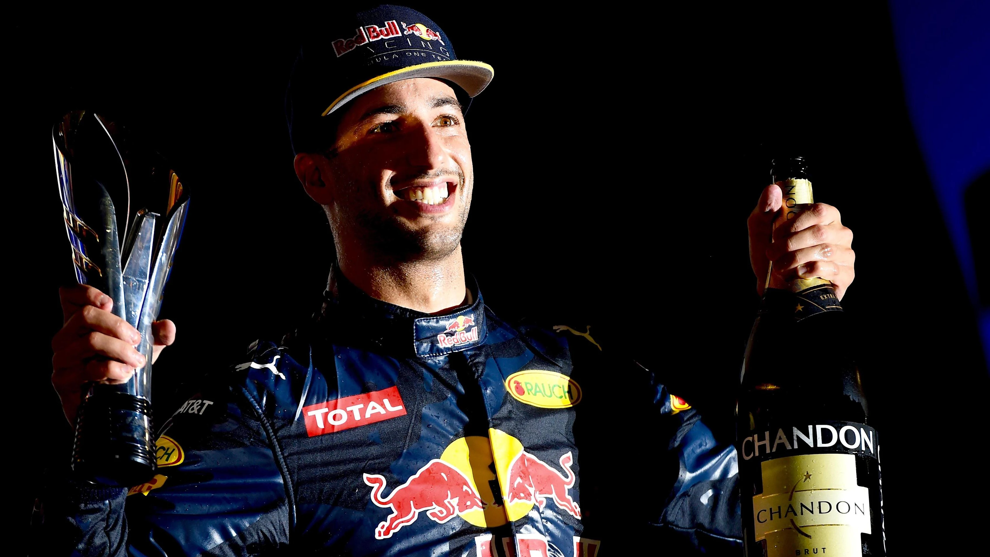 Daniel Ricciardo (AUS) Red Bull Racing celebrates on the podium with the champagne and the trophy
