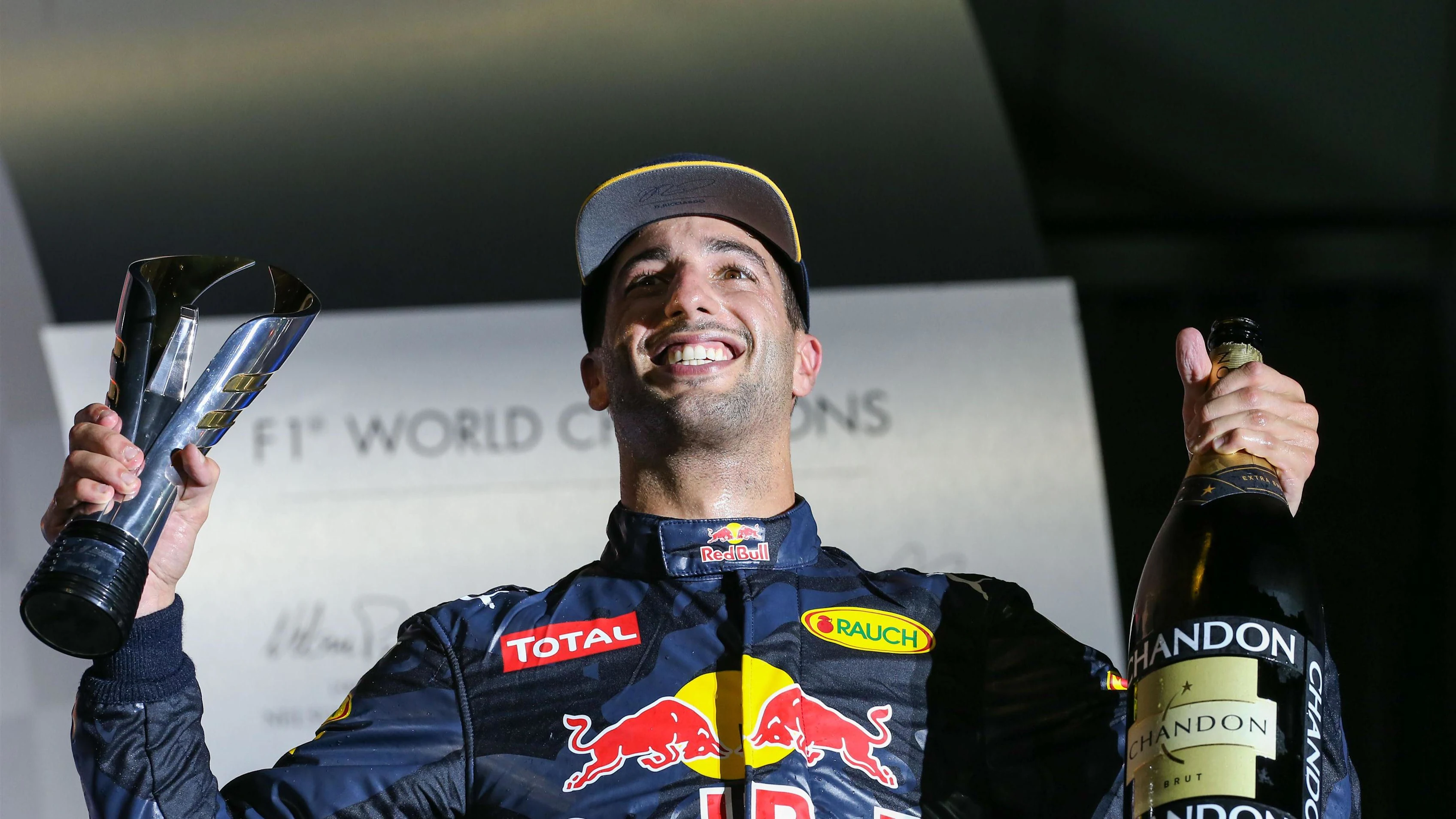 Daniel Ricciardo (AUS) Red Bull Racing celebrates on the podium with the champagne and the trophy