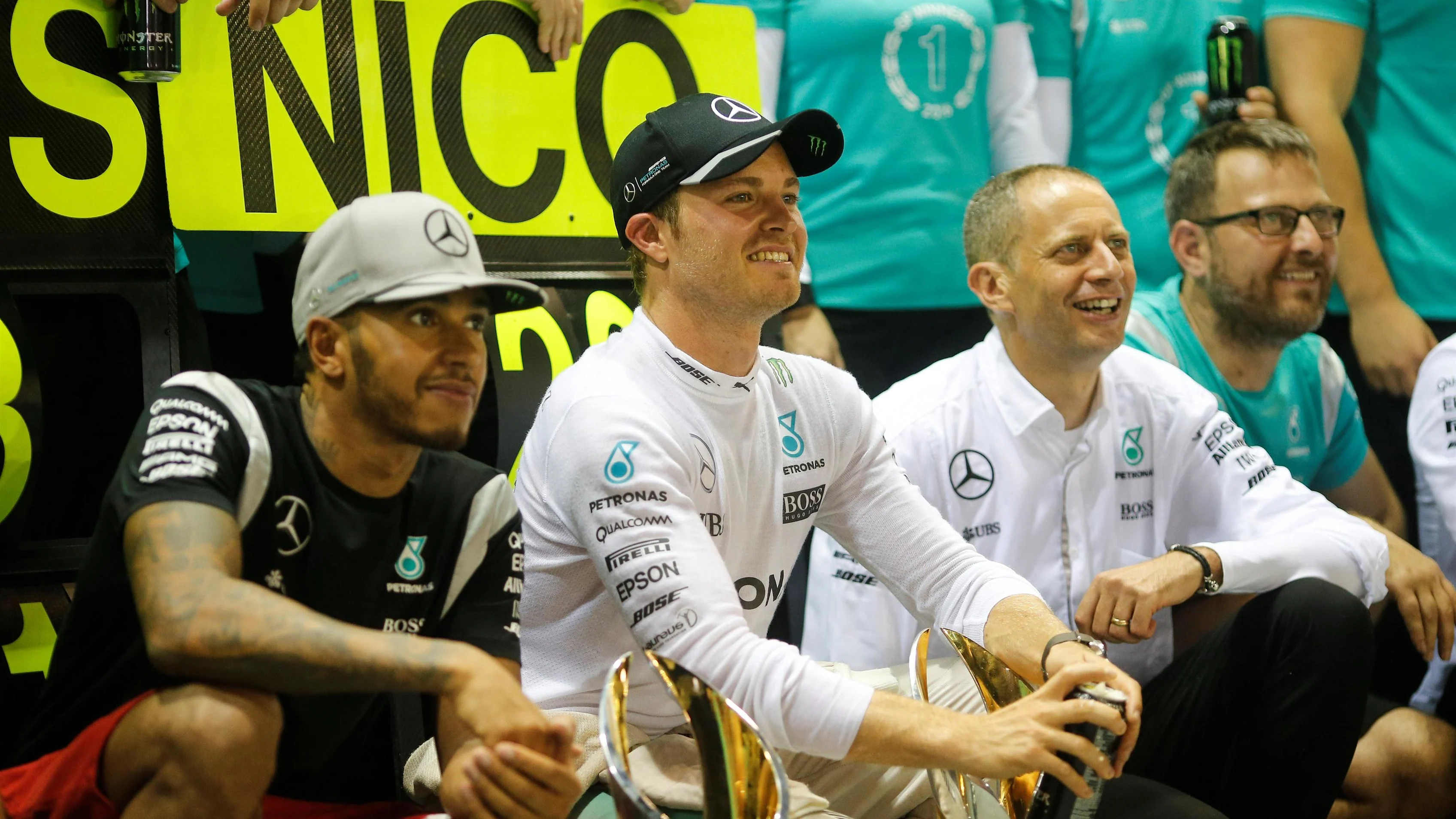 Lewis Hamilton (GBR) Mercedes AMG F1 and Nico Rosberg (GER) Mercedes AMG F1 celebrate with the team and the trophies at Formula One World Championship, Rd15, Singapore Grand Prix, Race, Marina Bay Street Circuit, Singapore, Sunday 18 September 2016. © Sutton Images