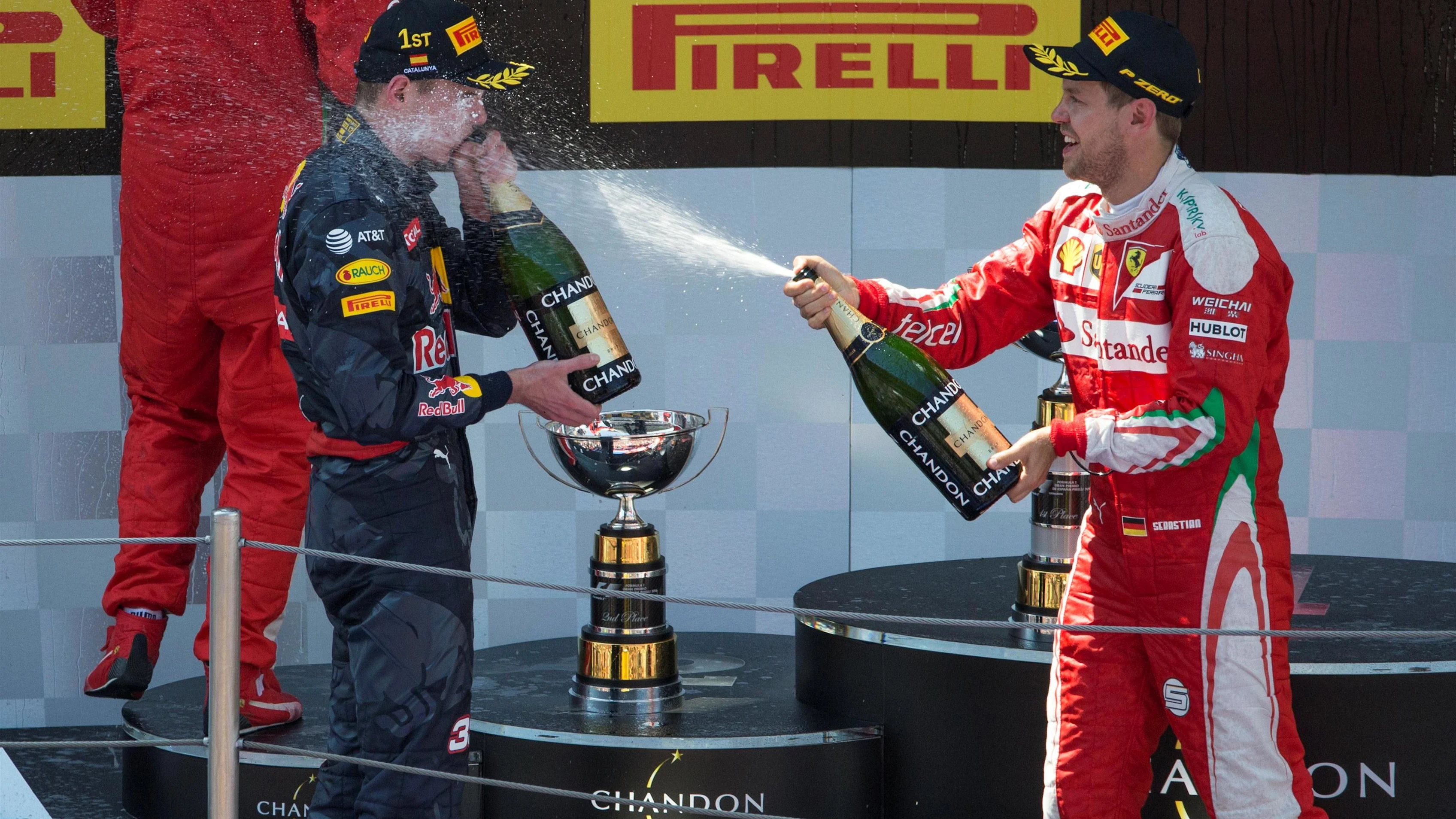 Max Verstappen (NED) Red Bull Racing and Sebastian Vettel (GER) Ferrari celebrate on the podium