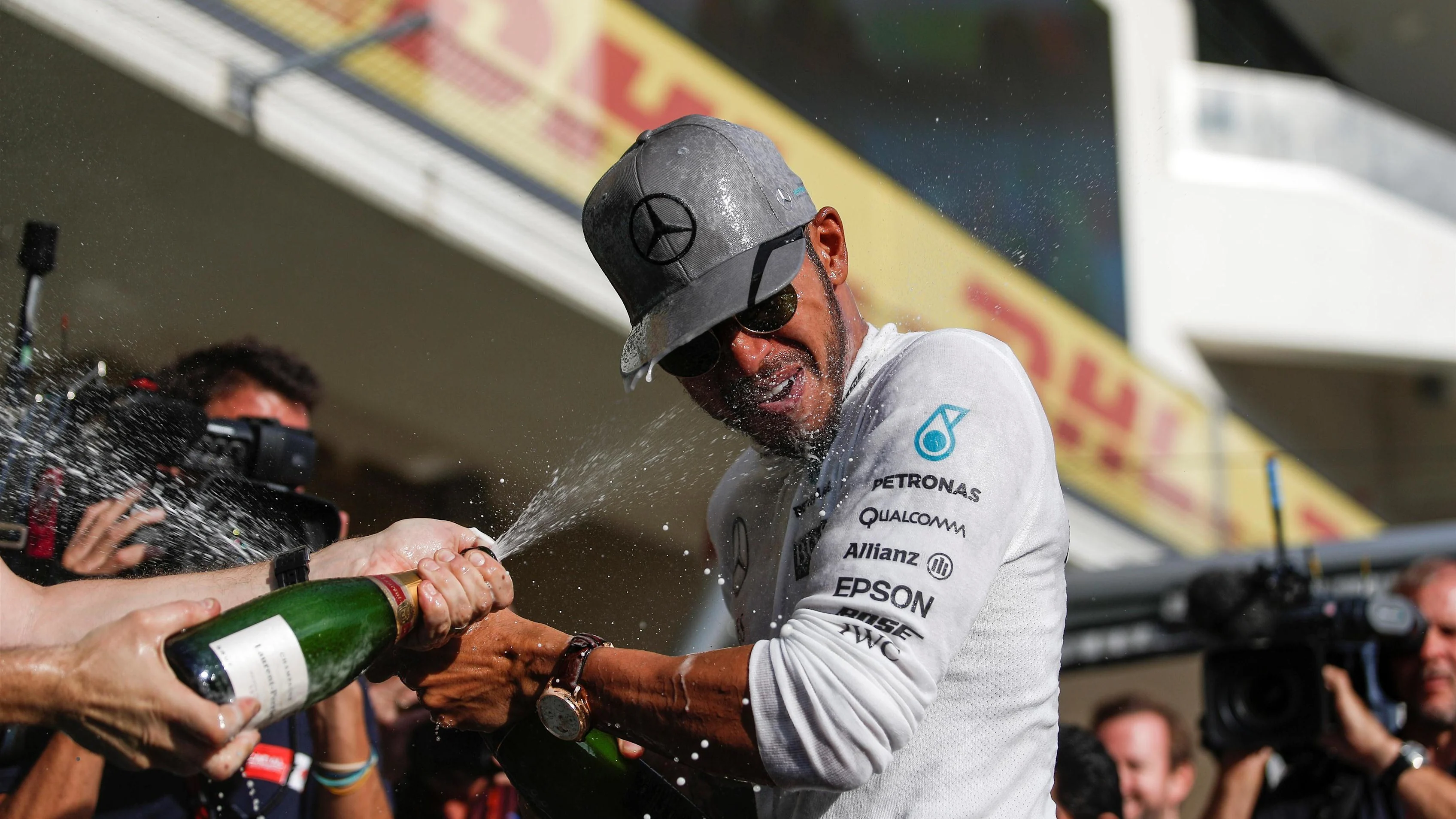 Race winner Lewis Hamilton (GBR) Mercedes AMG F1 celebrates with the team and the champagne at Formula One World Championship, Rd18, United States Grand Prix, Race, Circuit of the Americas, Austin, Texas, USA, Sunday 23 October 2016. © Sutton Images