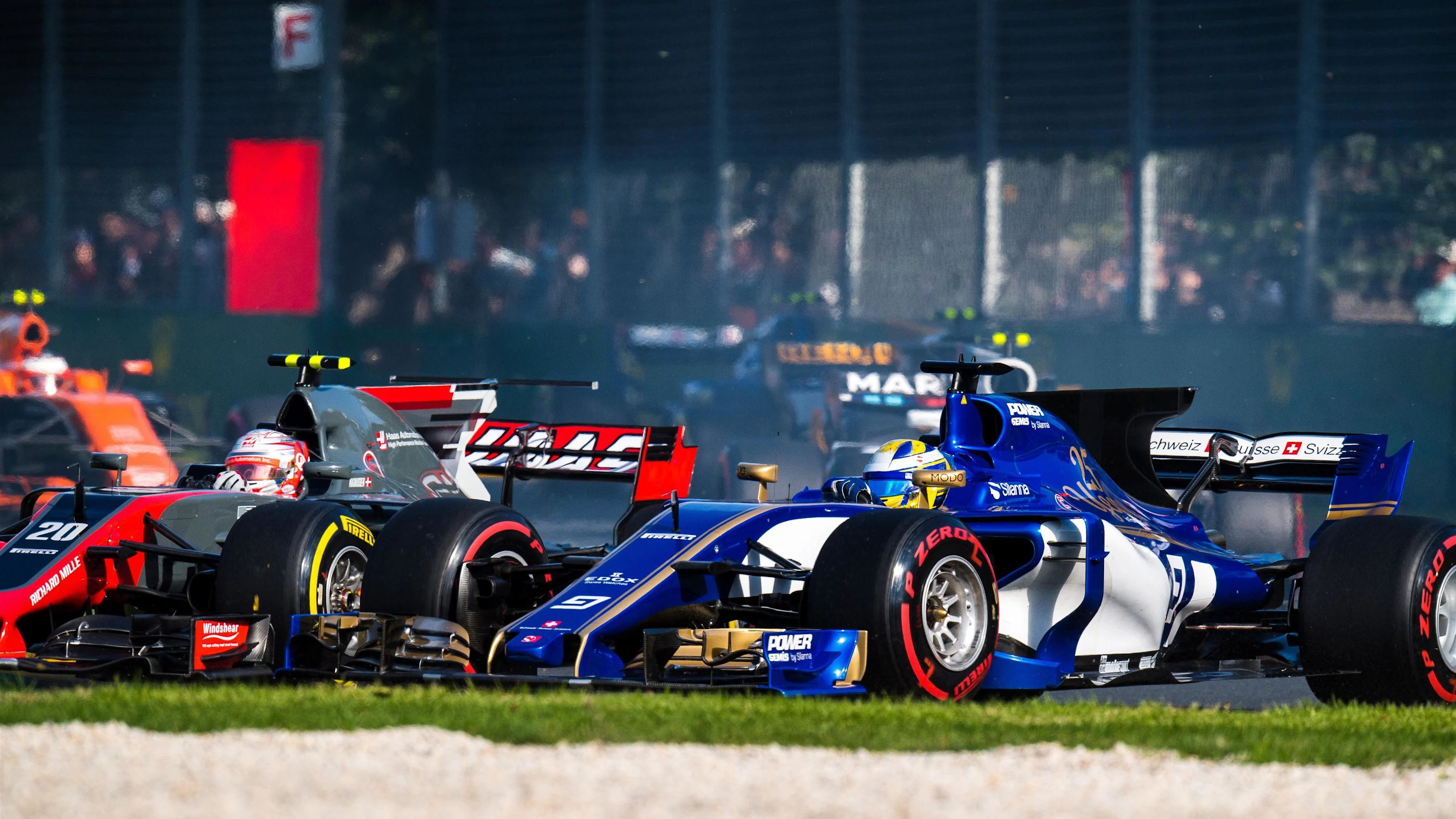 Marcus Ericsson (SWE) Sauber C36 and Kevin Magnussen (DEN) Haas VF-17 battle at Formula One World Championship, Rd1, Australian Grand Prix, Race, Albert Park, Melbourne, Australia, Sunday 26 March 2017. © Sutton Motorsport Images