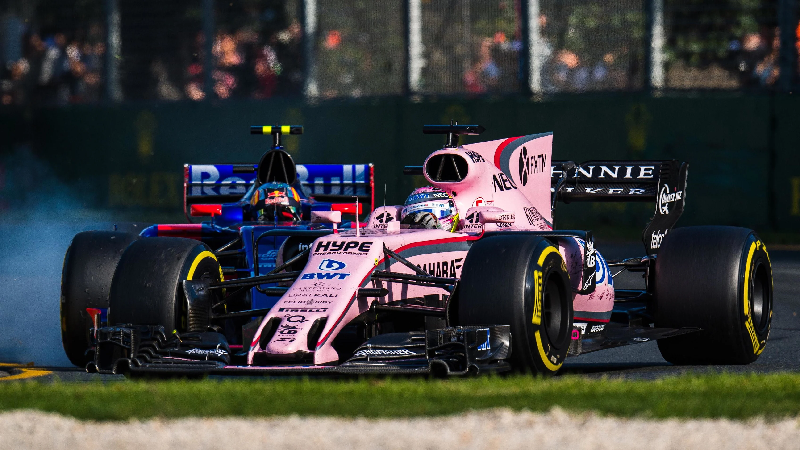 Sergio Perez (MEX) Force India VJM10 and Carlos Sainz (ESP) Scuderia Toro Rosso STR12 battle at Formula One World Championship, Rd1, Australian Grand Prix, Race, Albert Park, Melbourne, Australia, Sunday 26 March 2017. © Sutton Motorsport Images