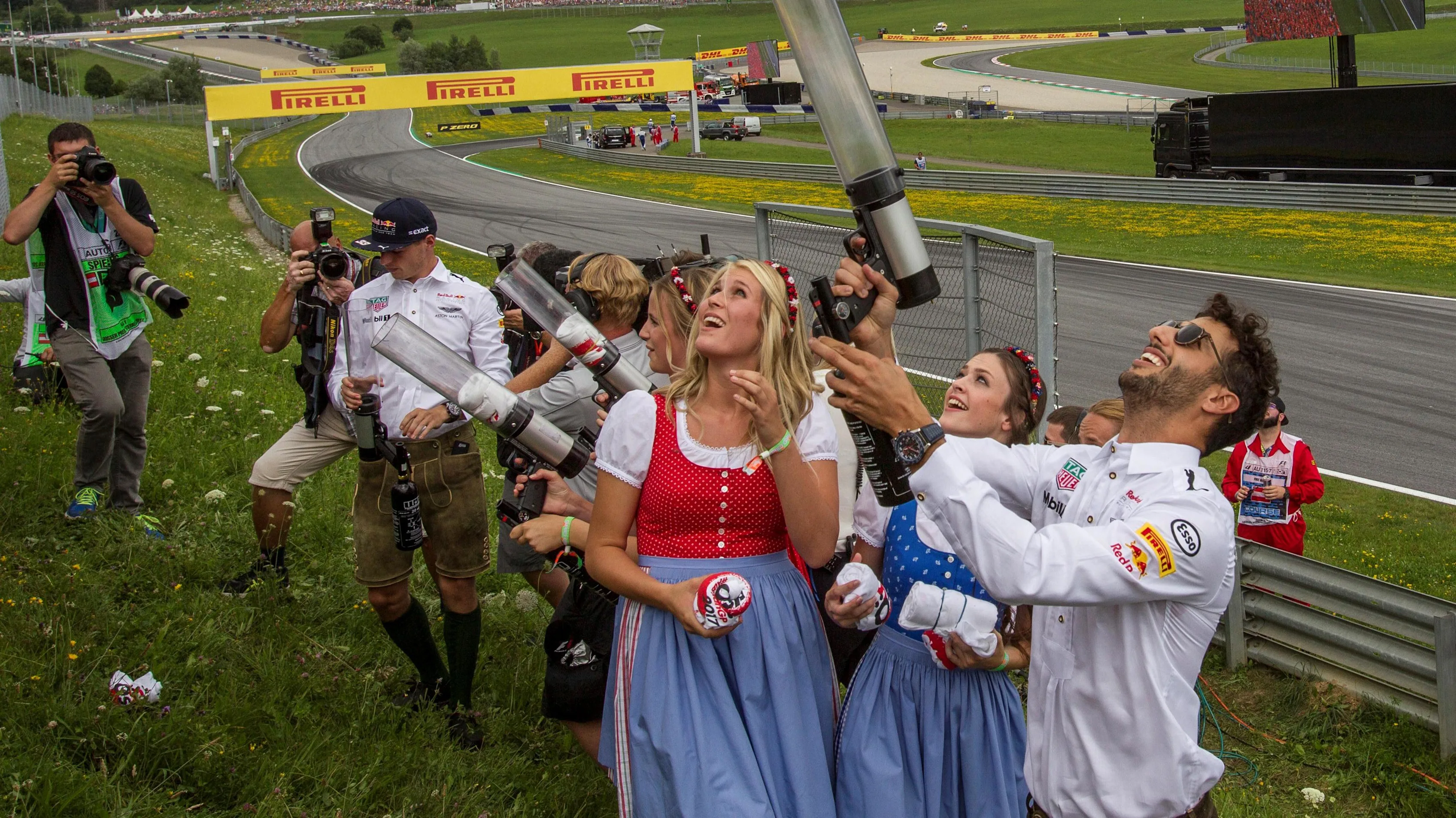 Daniel Ricciardo (AUS) Red Bull Racing shoots T-shirts into the crowd on the drivers parade at