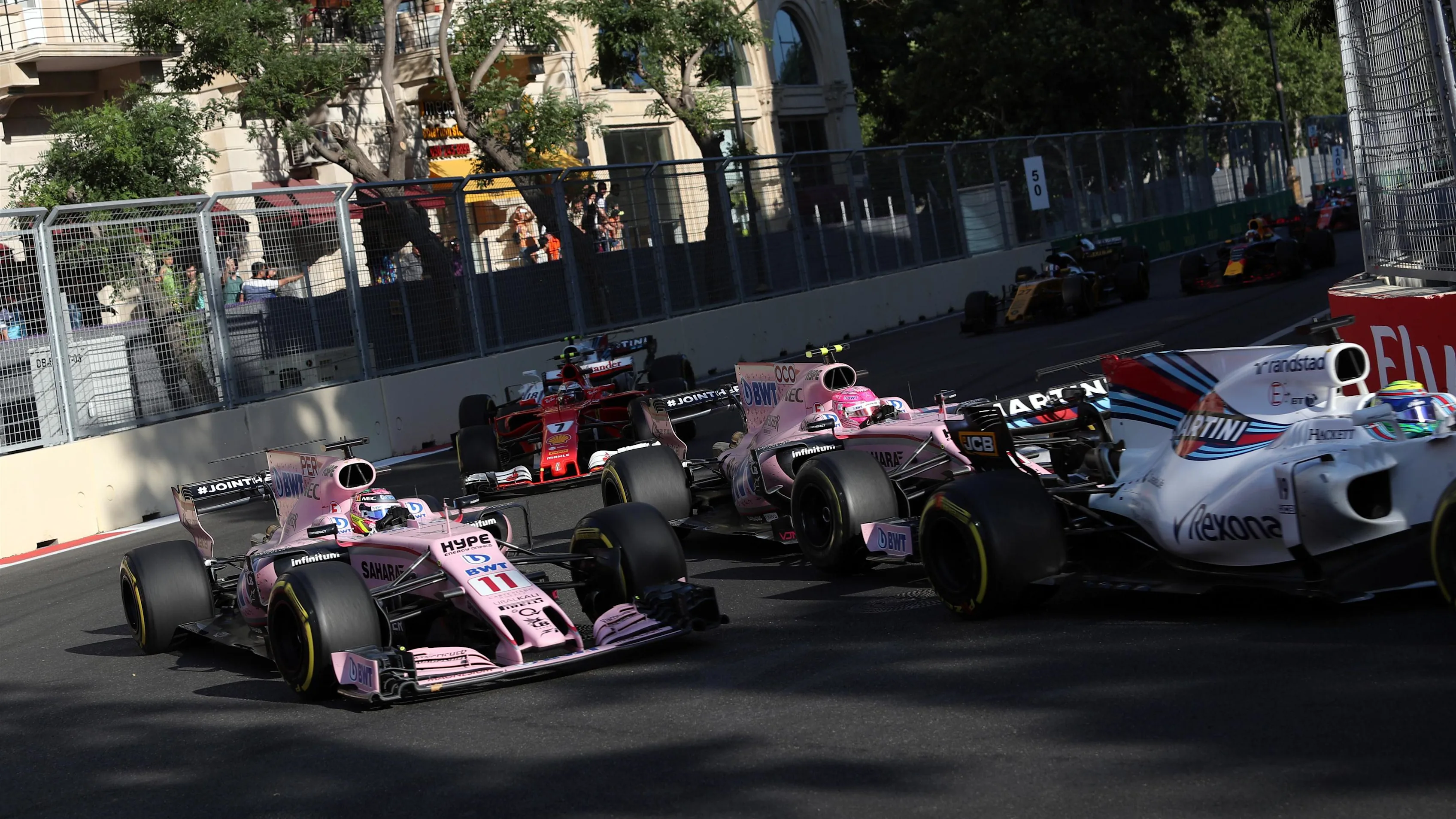 Sergio Perez (MEX) Force India VJM10 and Esteban Ocon (FRA) Force India VJM10 at the restart at