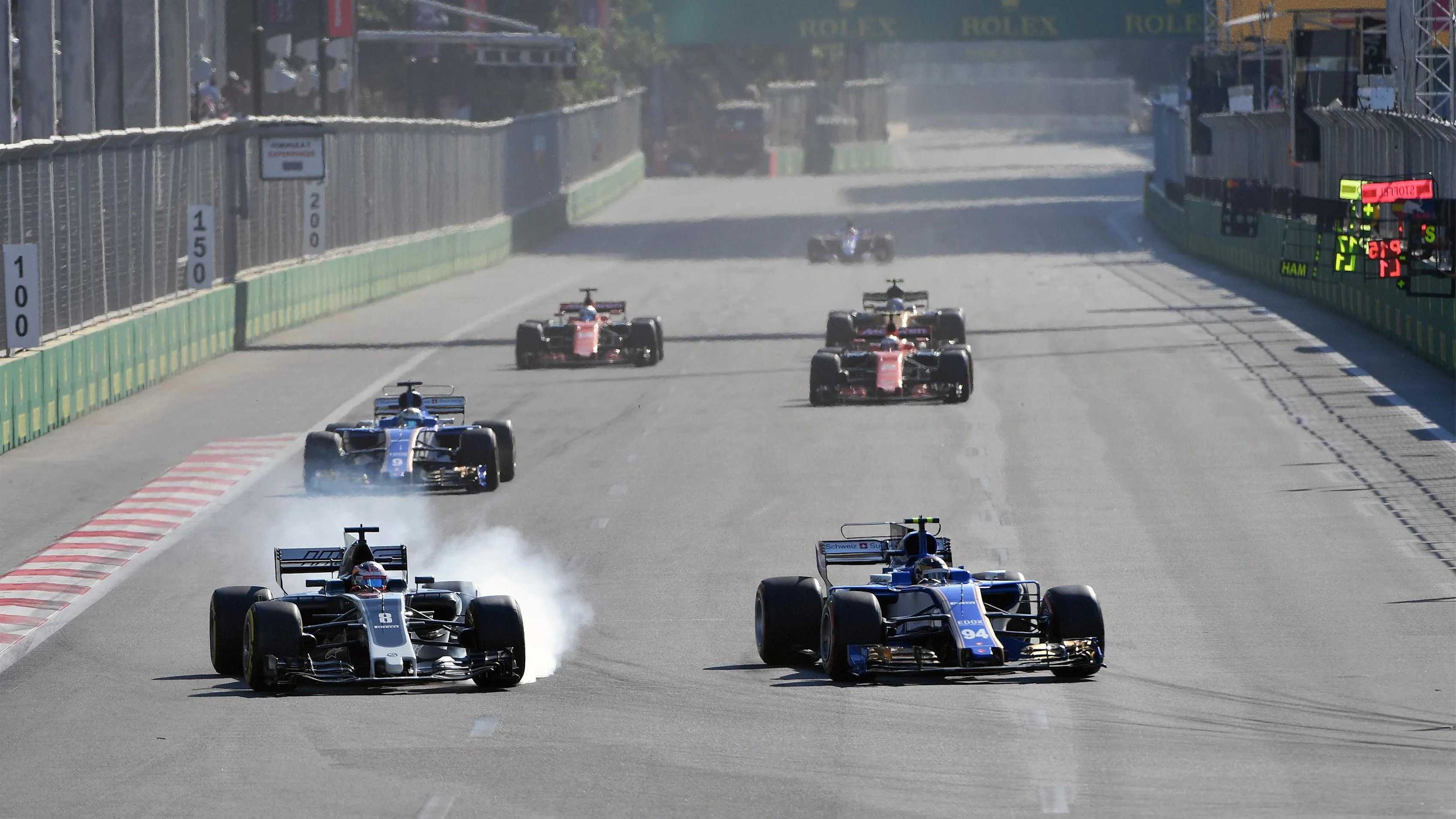 Romain Grosjean (FRA) Haas VF-17 locks up and battles with Pascal Wehrlein (GER) Sauber C36 at Formula One World Championship, Rd8, Azerbaijan Grand Prix, Race, Baku City Circuit, Baku, Azerbaijan, Sunday 25 June 2017. © Sutton Images