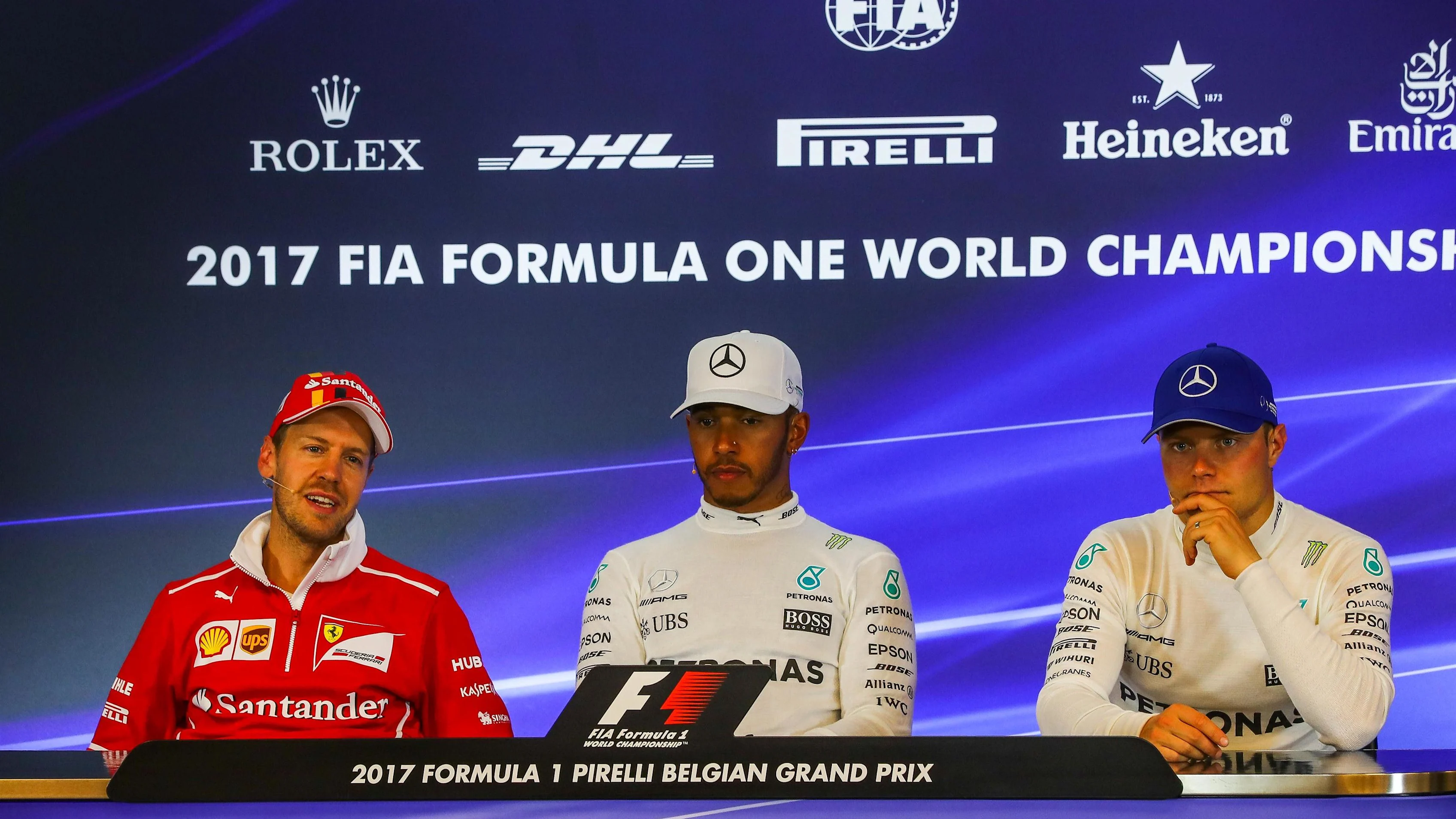 Sebastian Vettel (GER) Ferrari, Lewis Hamilton (GBR) Mercedes AMG F1 and Valtteri Bottas (FIN)