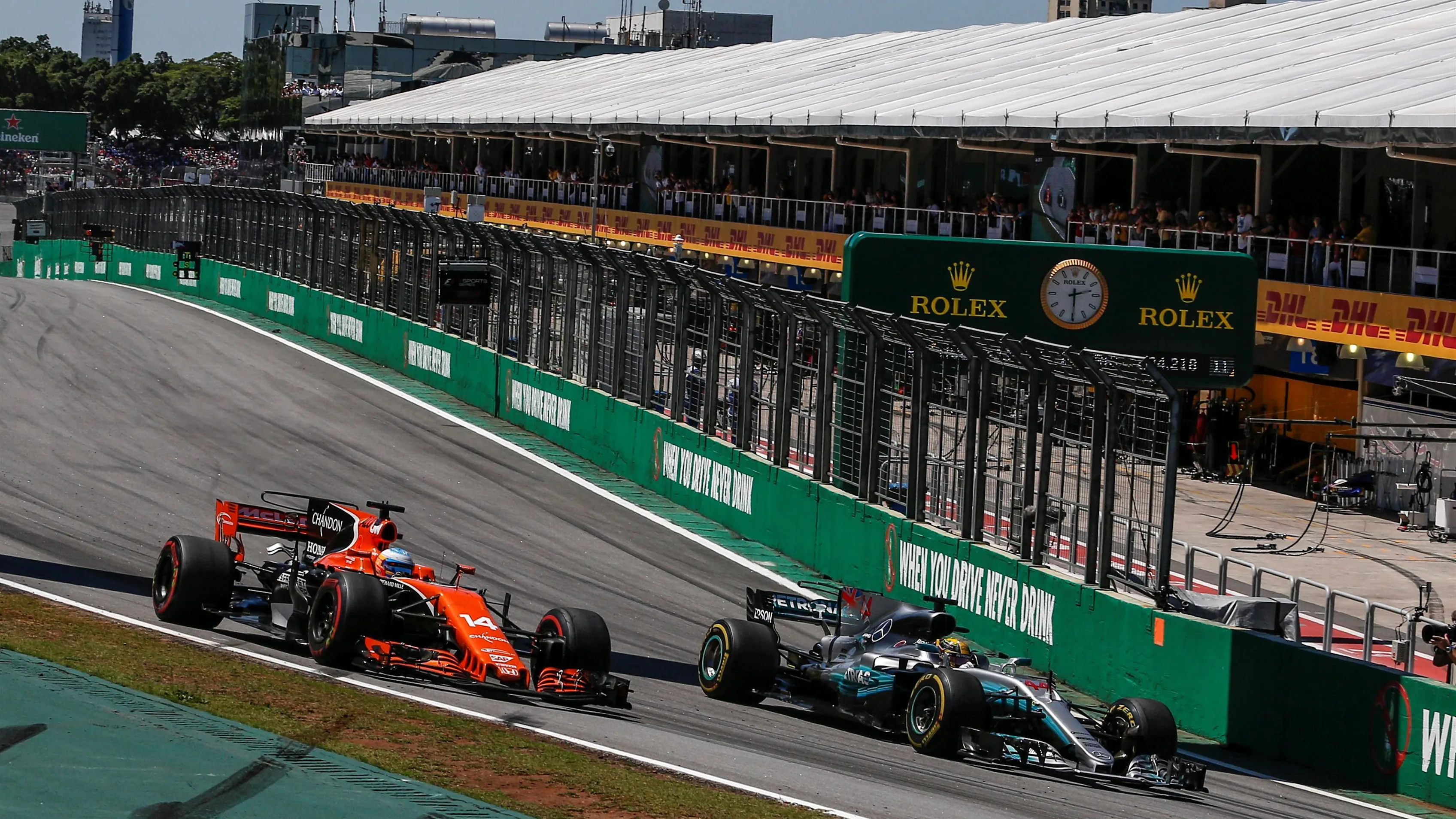 Alonso (ESP) McLaren MCL32 and Hamilton (GBR) Mercedes-Benz F1 W08 Hybrid battle for position at Formula One World Championship, Rd19, Brazilian Grand Prix, Race, Interlagos, Sao Paulo, Brazil, Sunday 12 November 2017. © Manuel Goria/Sutton Images