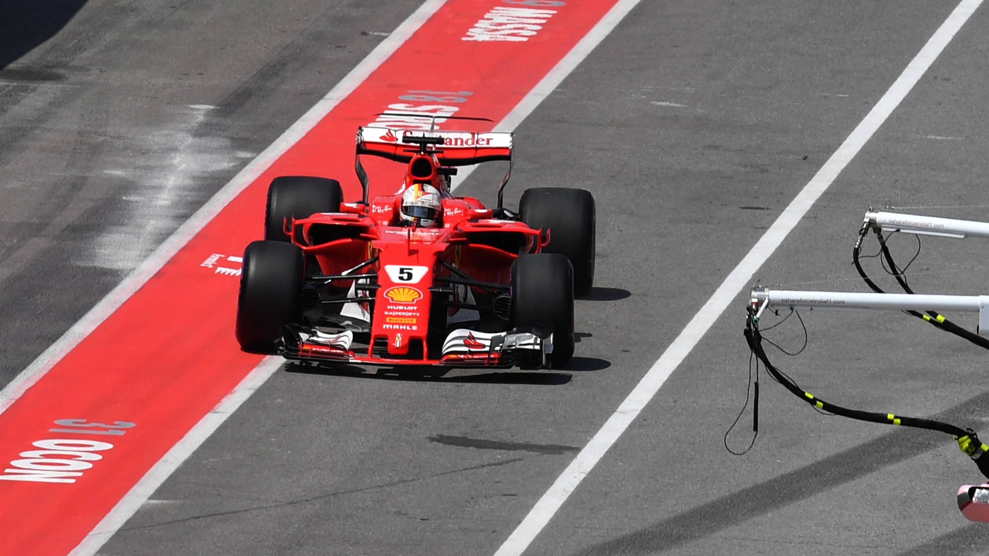 Sebastian Vettel (GER) Ferrari SF70-H makes a pit stop with a dmaged front wing at Formula One