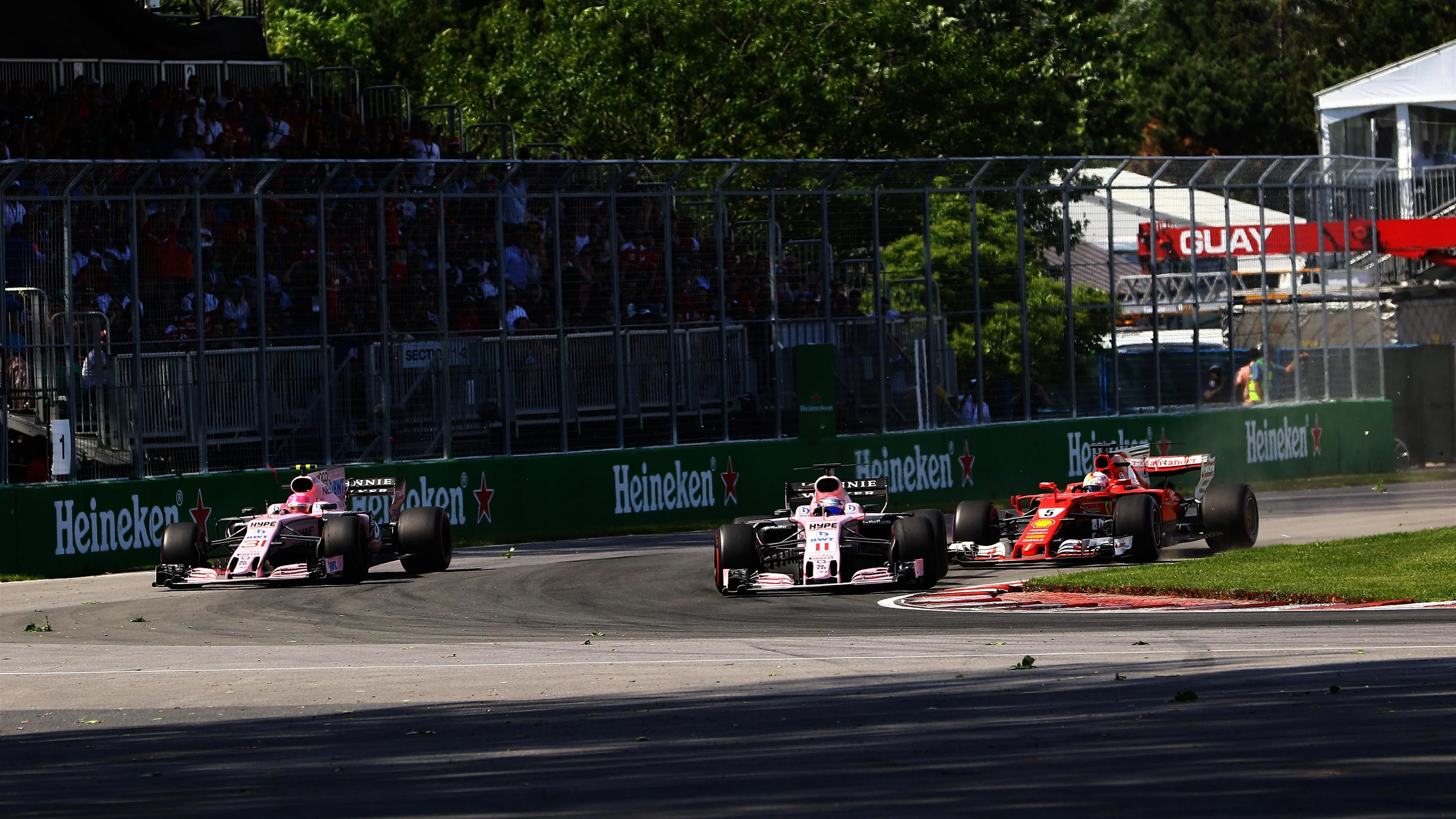 Esteban Ocon (FRA) Force India VJM10, Sergio Perez (MEX) Force India VJM10 and Sebastian Vettel