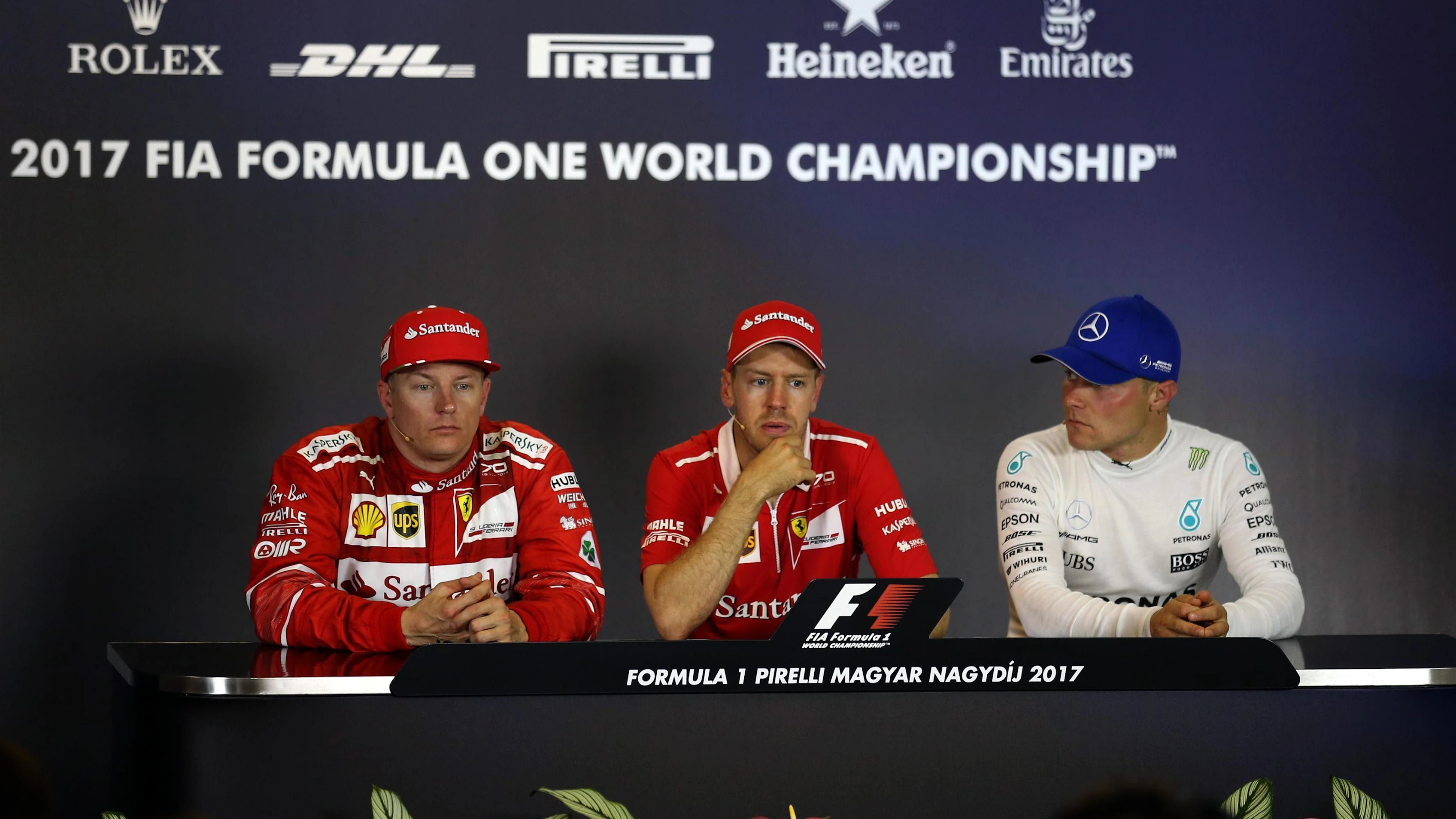 Kimi Raikkonen (FIN) Ferrari, race winner Sebastian Vettel (GER) Ferrari and Valtteri Bottas (FIN)
