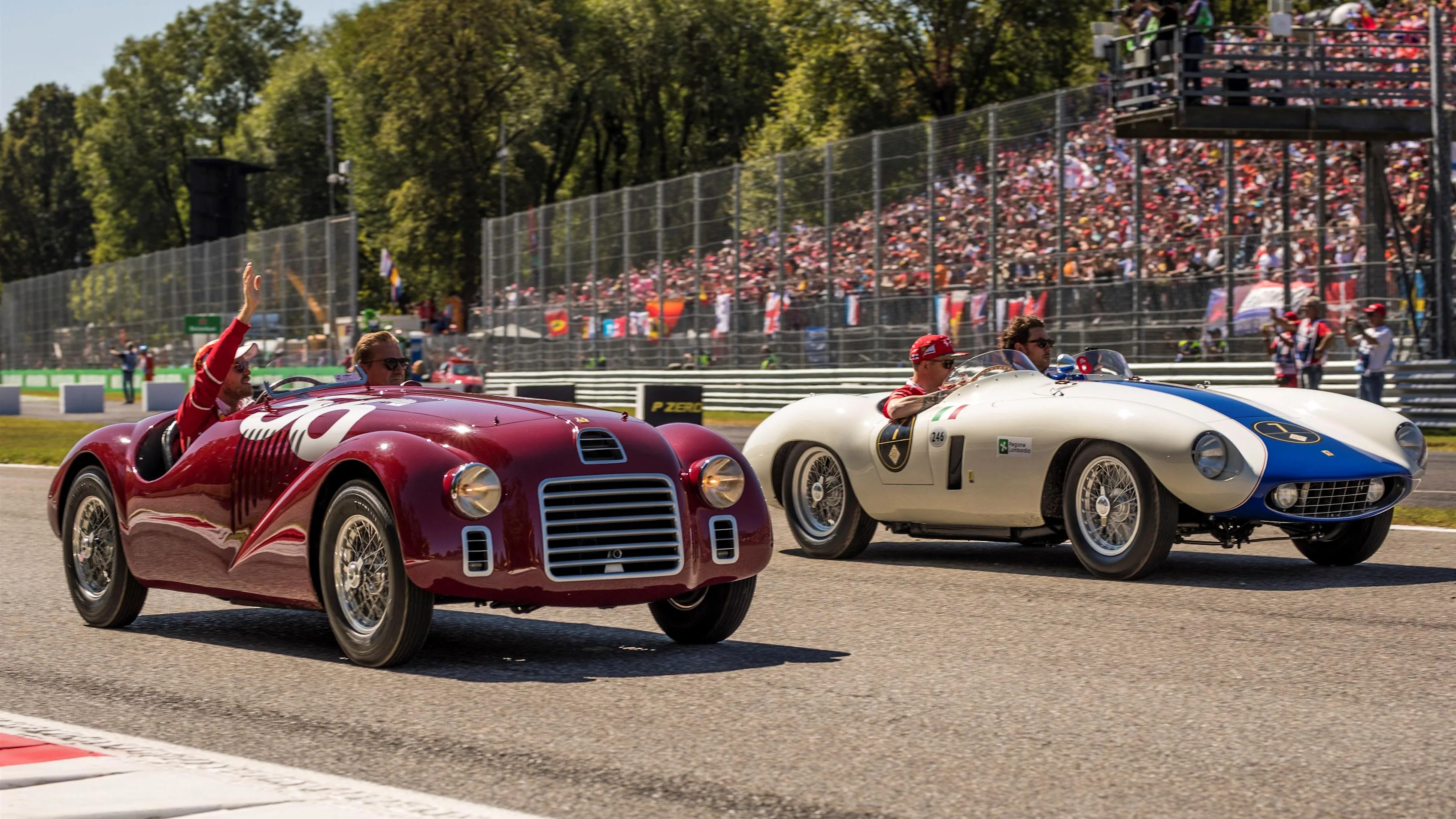 Sebastian Vettel (GER) Ferrari and Kimi Raikkonen (FIN) Ferrari on the drivers parade at Formula