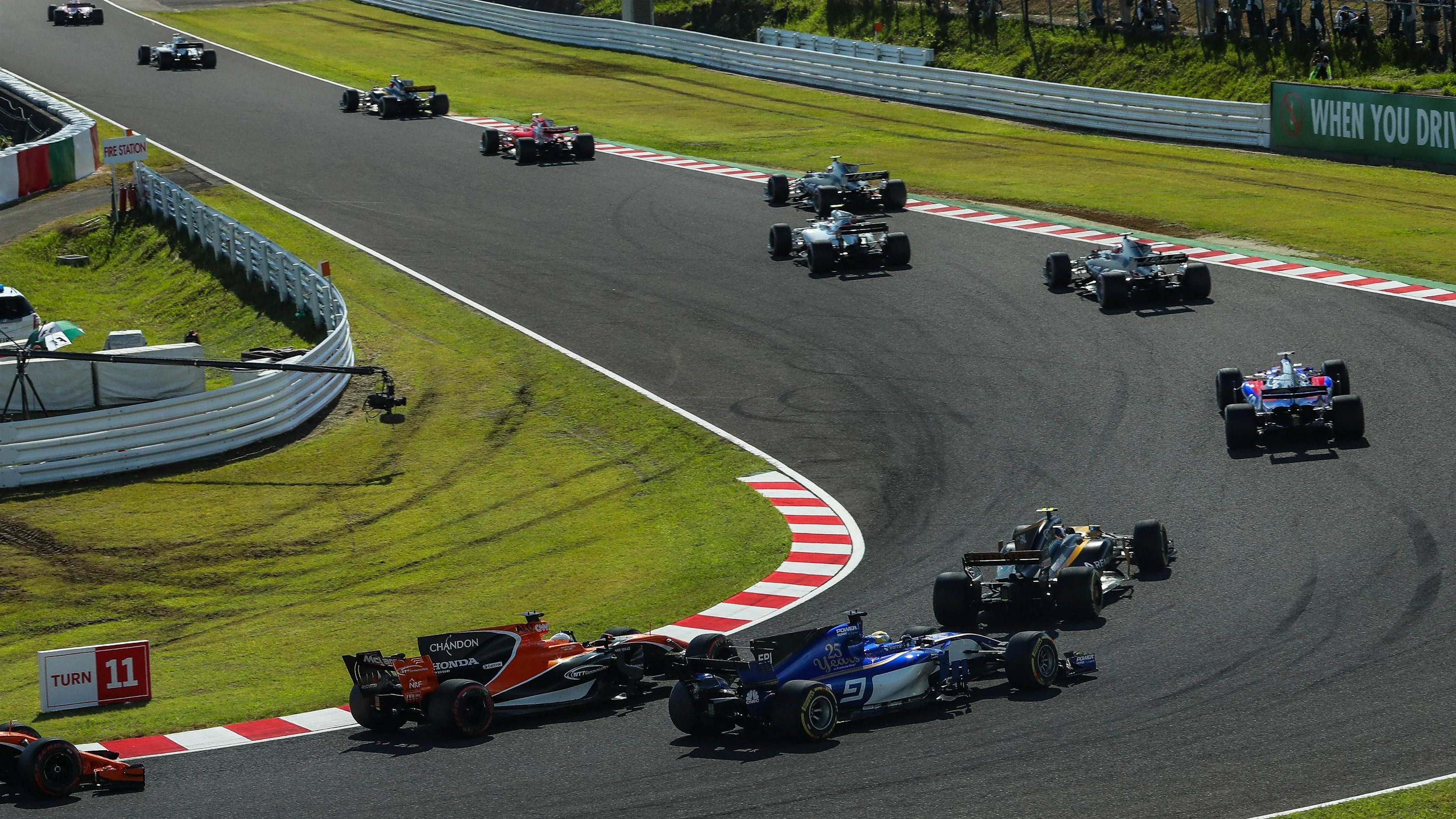 Marcus Ericsson (SWE) Sauber C36 and Fernando Alonso (ESP) McLaren MCL32 battle for position at the start of the race at Formula One World Championship, Rd16, Japanese Grand Prix, Race, Suzuka, Japan, Sunday 8 October 2017. © Kym Illman/Sutton Images