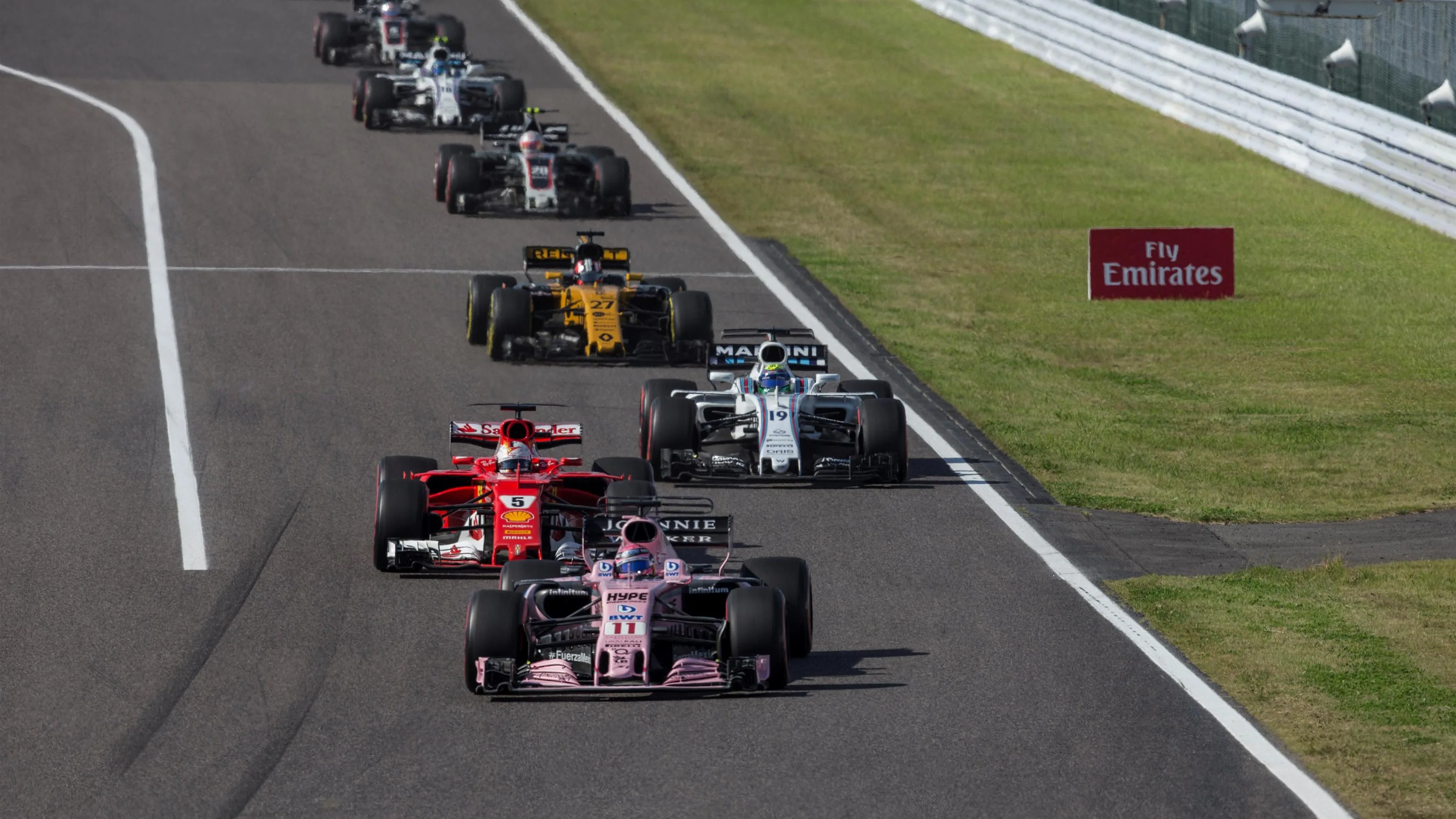 Sergio Perez (MEX) Force India VJM10 and Sebastian Vettel (GER) Ferrari SF70-H battle for position at Formula One World Championship, Rd16, Japanese Grand Prix, Race, Suzuka, Japan, Sunday 8 October 2017. © Manuel Goria/Sutton Images