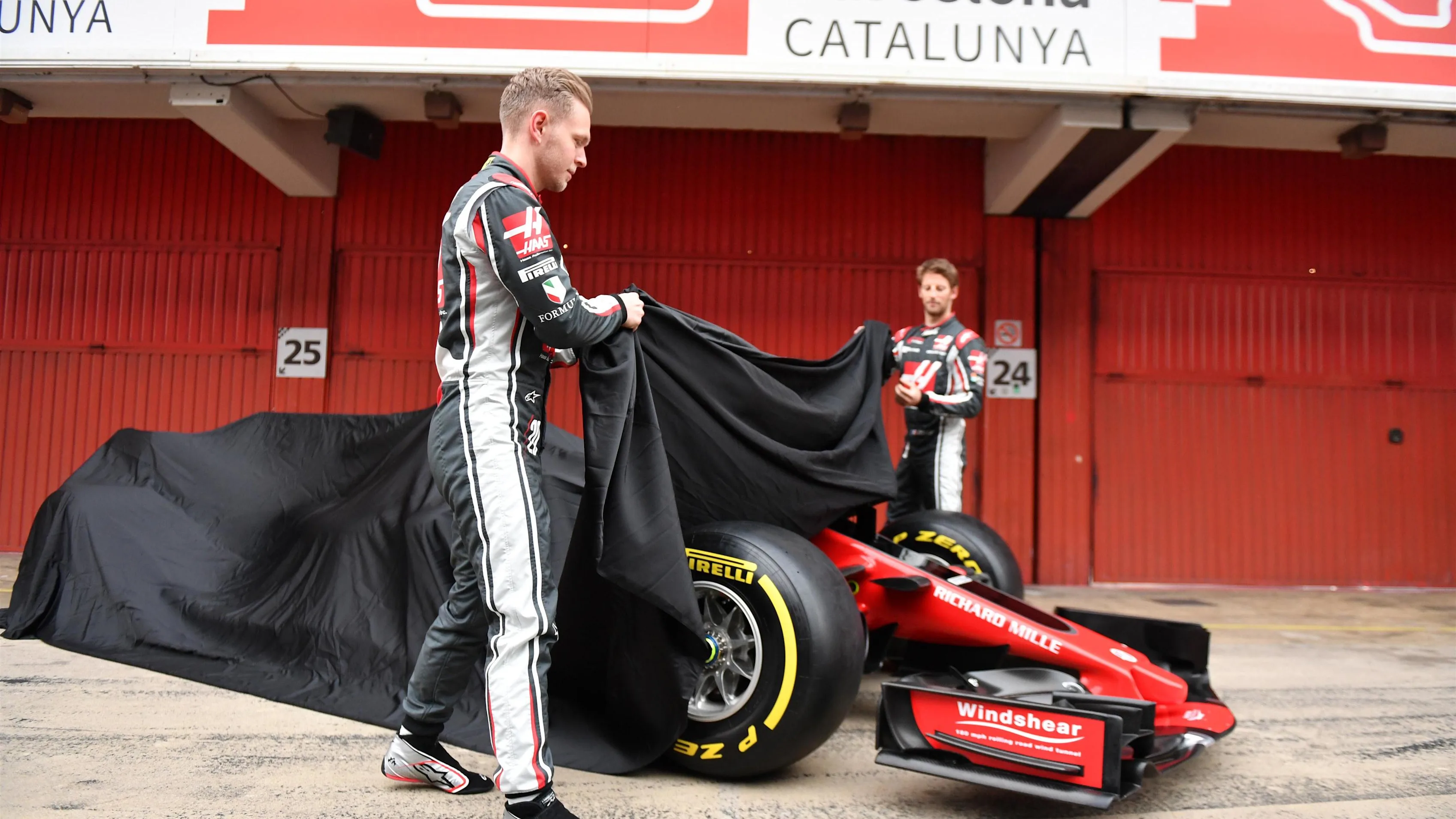 Kevin Magnussen (DEN) Haas F1 and Romain Grosjean (FRA) Haas F1 unveil the new Haas VF-17 at Haas VF-17 Launch, Barcelona, Spain, 27 February 2017. © Sutton Images
