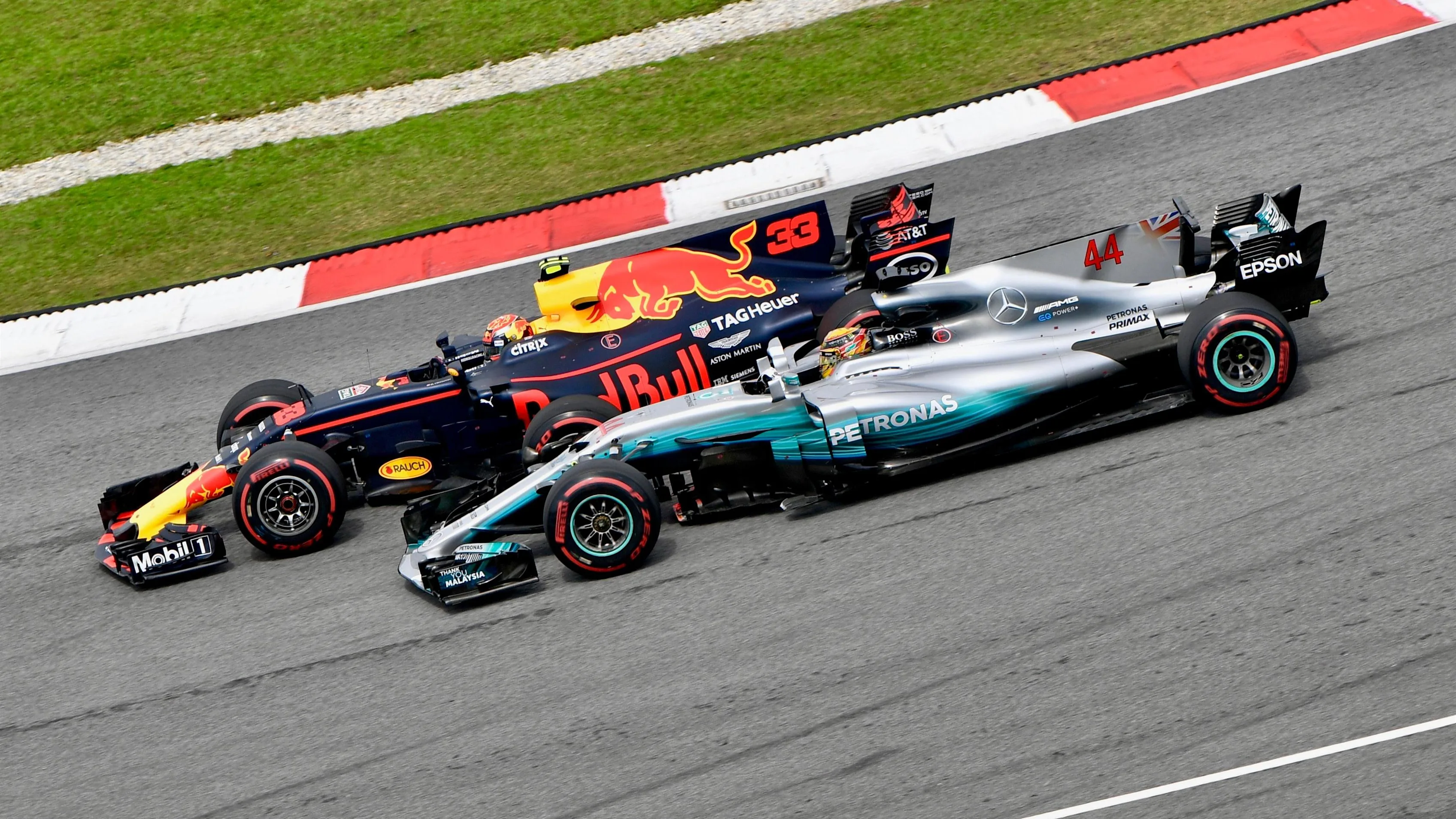 Max Verstappen (NED) Red Bull Racing RB13 passes Lewis Hamilton (GBR) Mercedes-Benz F1 W08 Hybrid for the lead at Formula One World Championship, Rd15, Malaysian Grand Prix, Race, Sepang, Malaysia, Sunday 1 October 2017. © Sutton Images