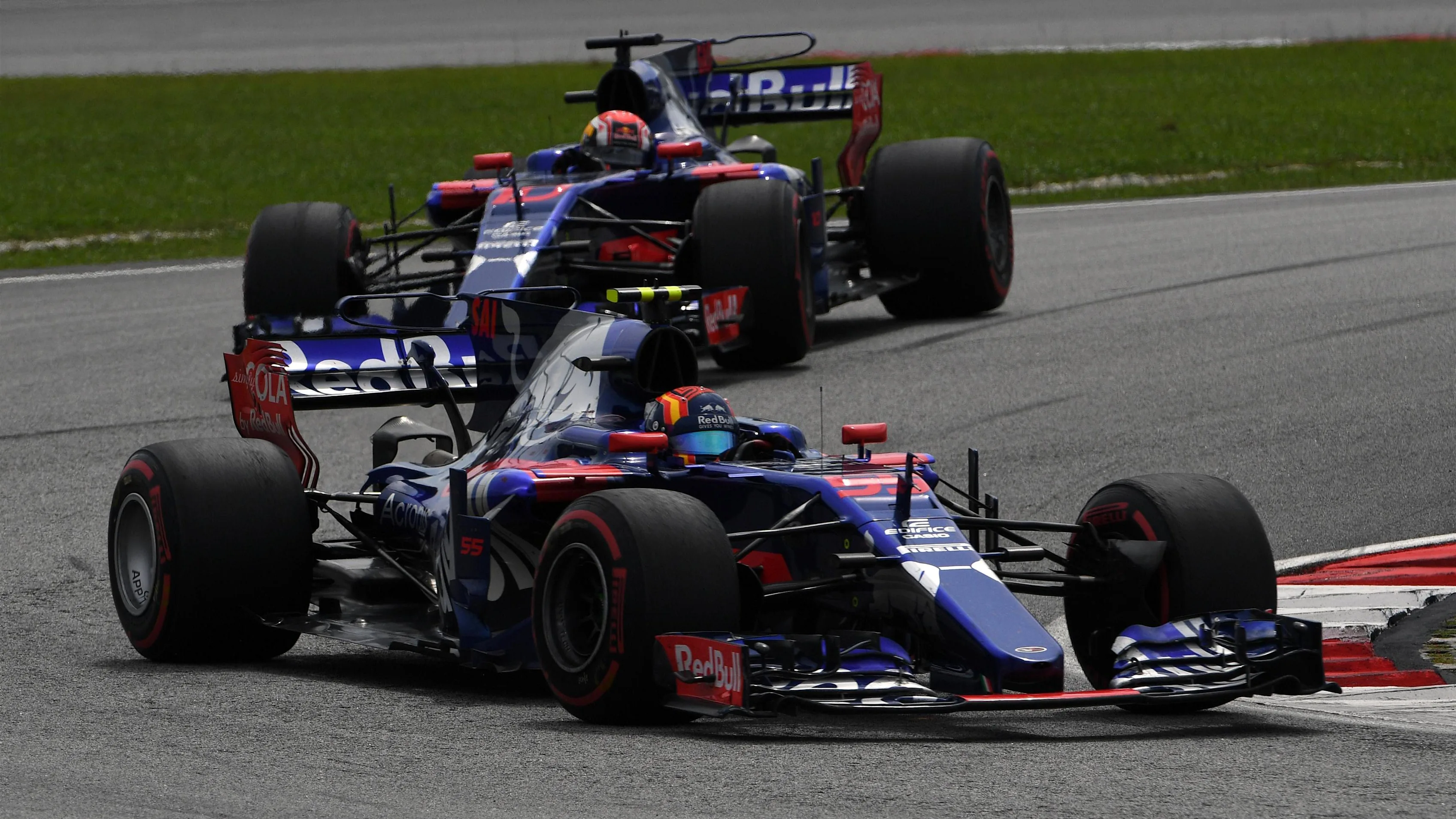 Carlos Sainz (ESP) Scuderia Toro Rosso STR12 leads Pierre Gasly (FRA) Scuderia Toro Rosso STR12 at Formula One World Championship, Rd15, Malaysian Grand Prix, Race, Sepang, Malaysia, Sunday 1 October 2017. © Mark Sutton/Sutton Images