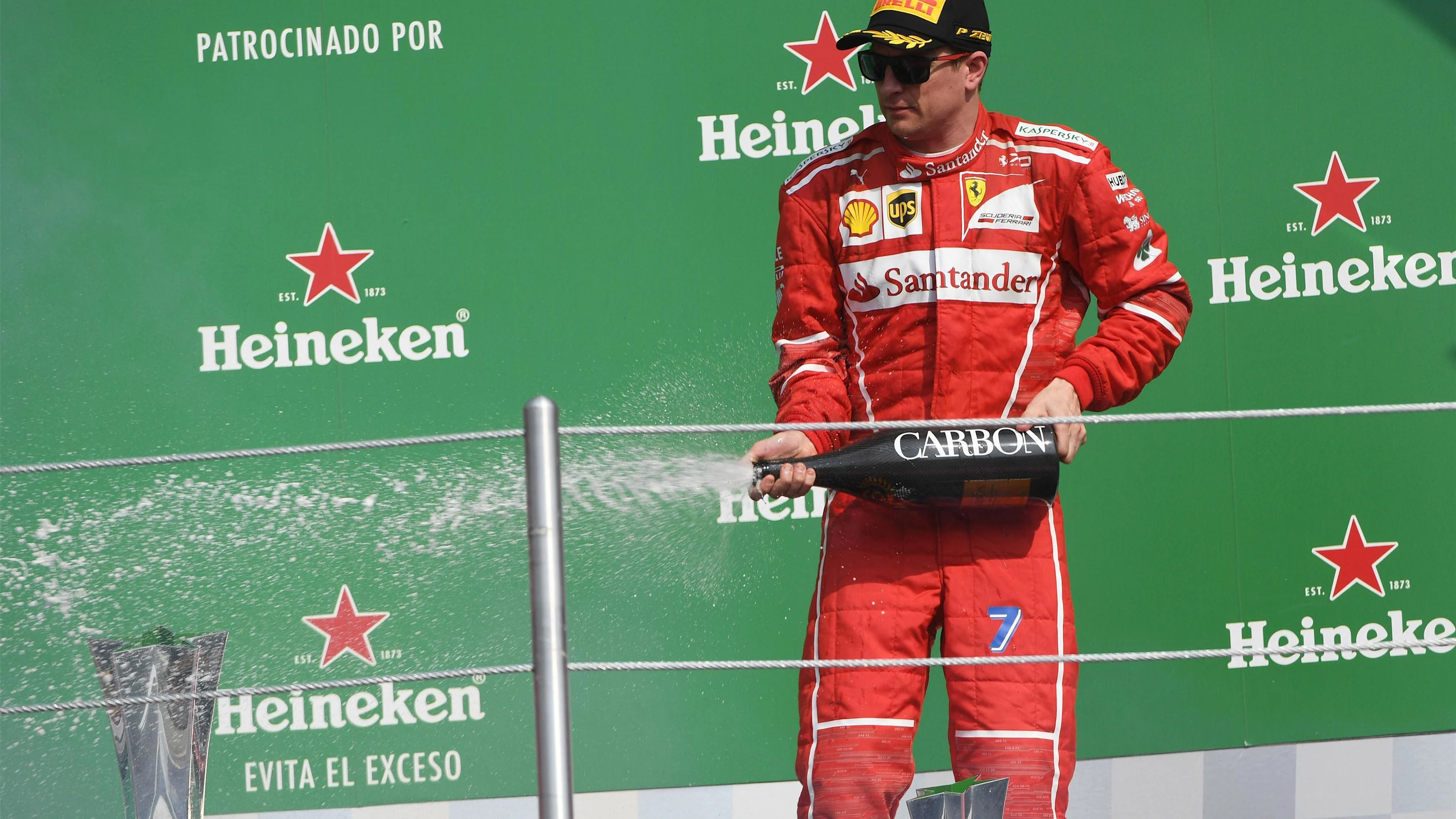 Kimi Raikkonen (FIN) Ferrari celebrates on the podium with the champagne at Formula One World