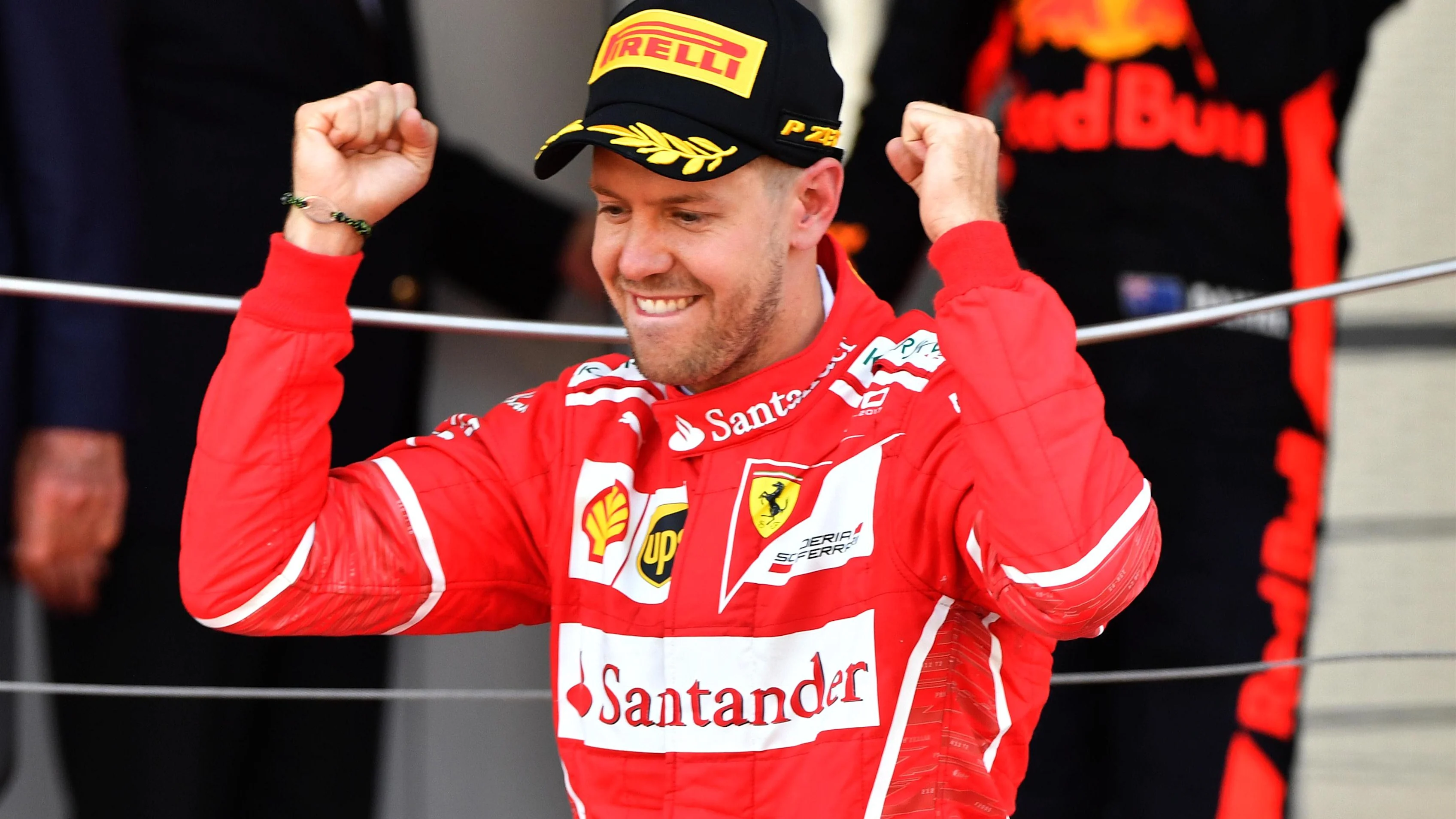 Race winner Sebastian Vettel (GER) Ferrari celebrates on the podium at Formula One World
