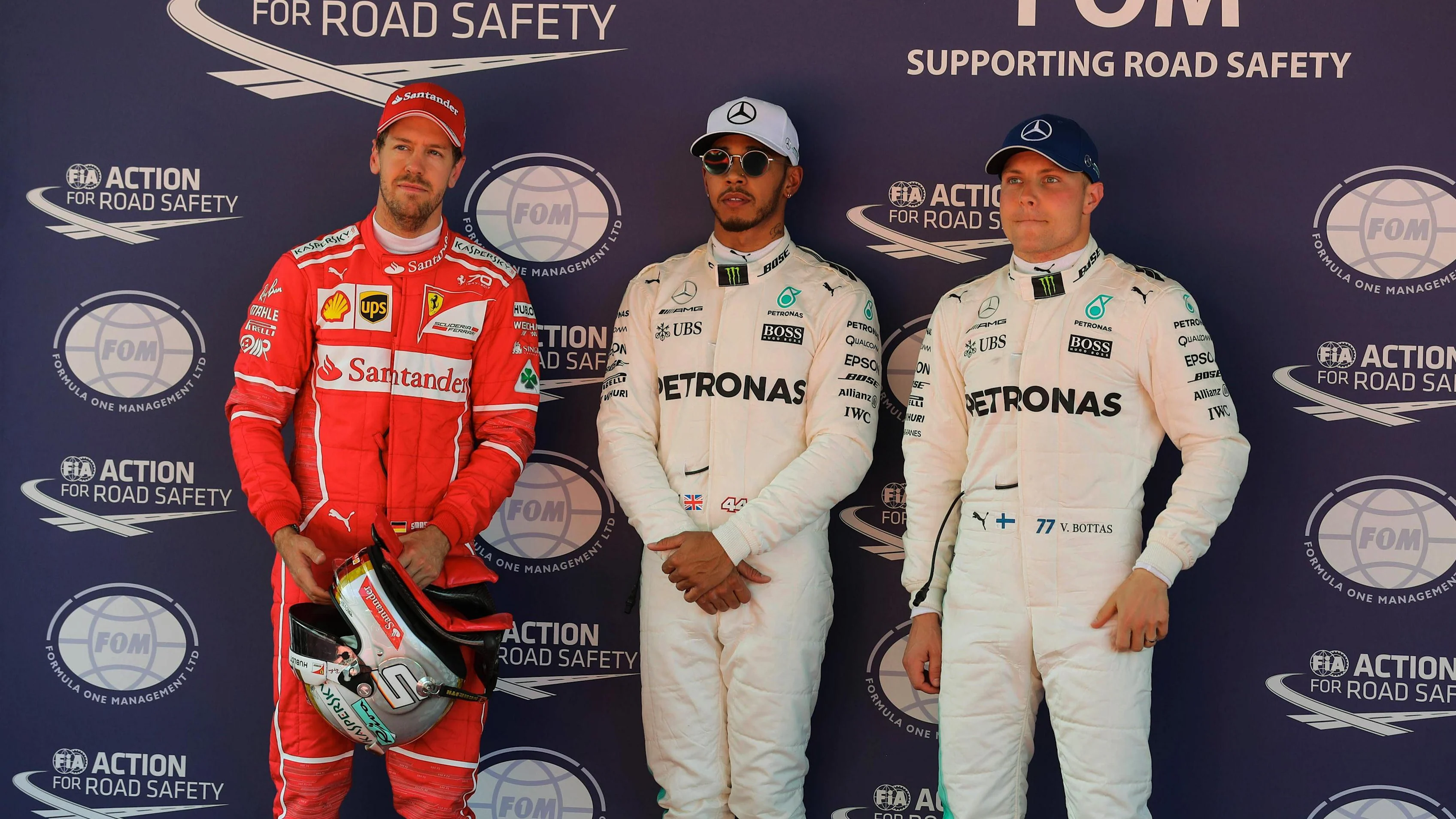 (L to R): Sebastian Vettel (GER) Ferrari, pole sitter Lewis Hamilton (GBR) Mercedes AMG F1 and