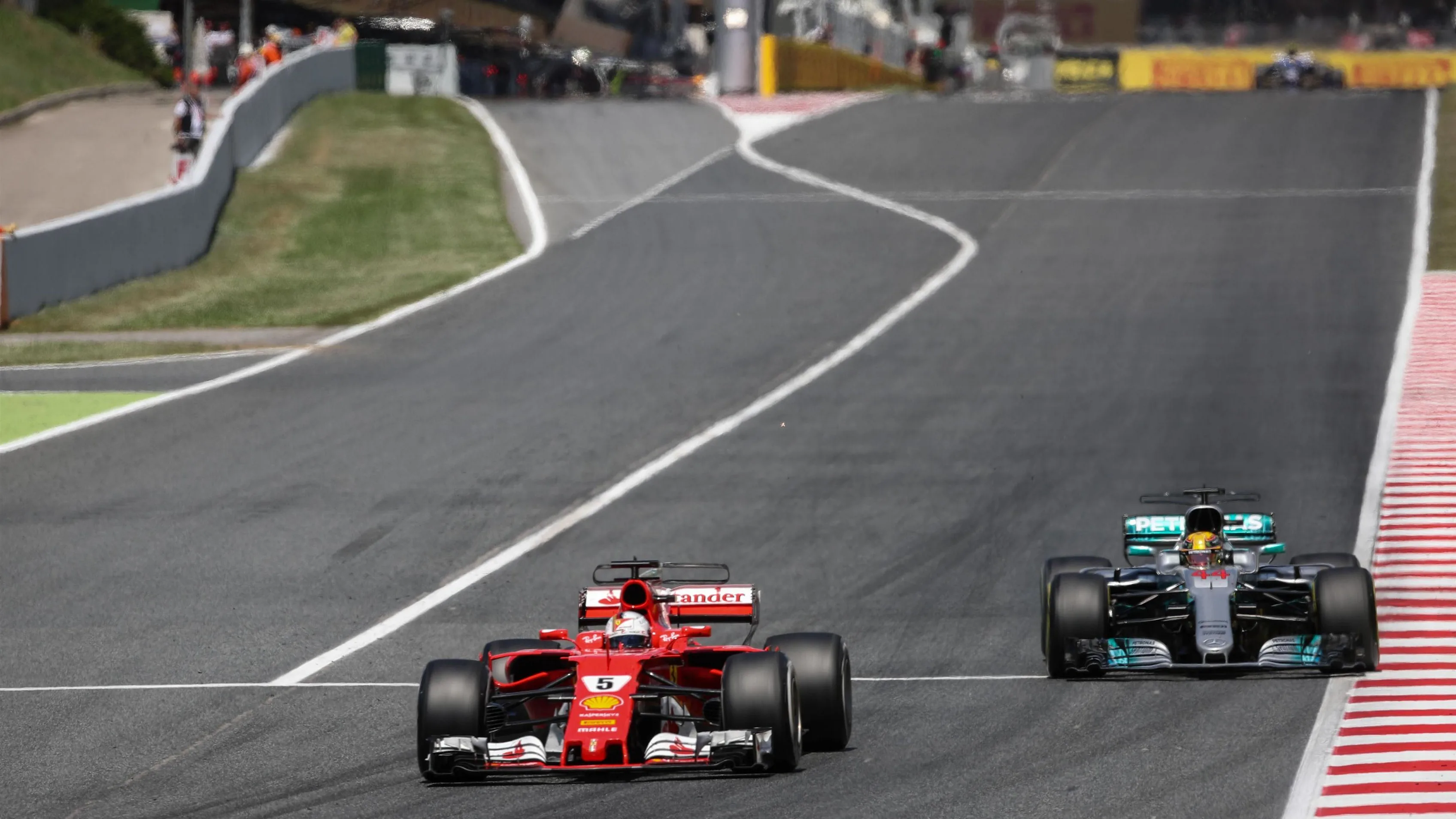 Sebastian Vettel (GER) Ferrari SF70-H battles for position with Lewis Hamilton (GBR) Mercedes-Benz