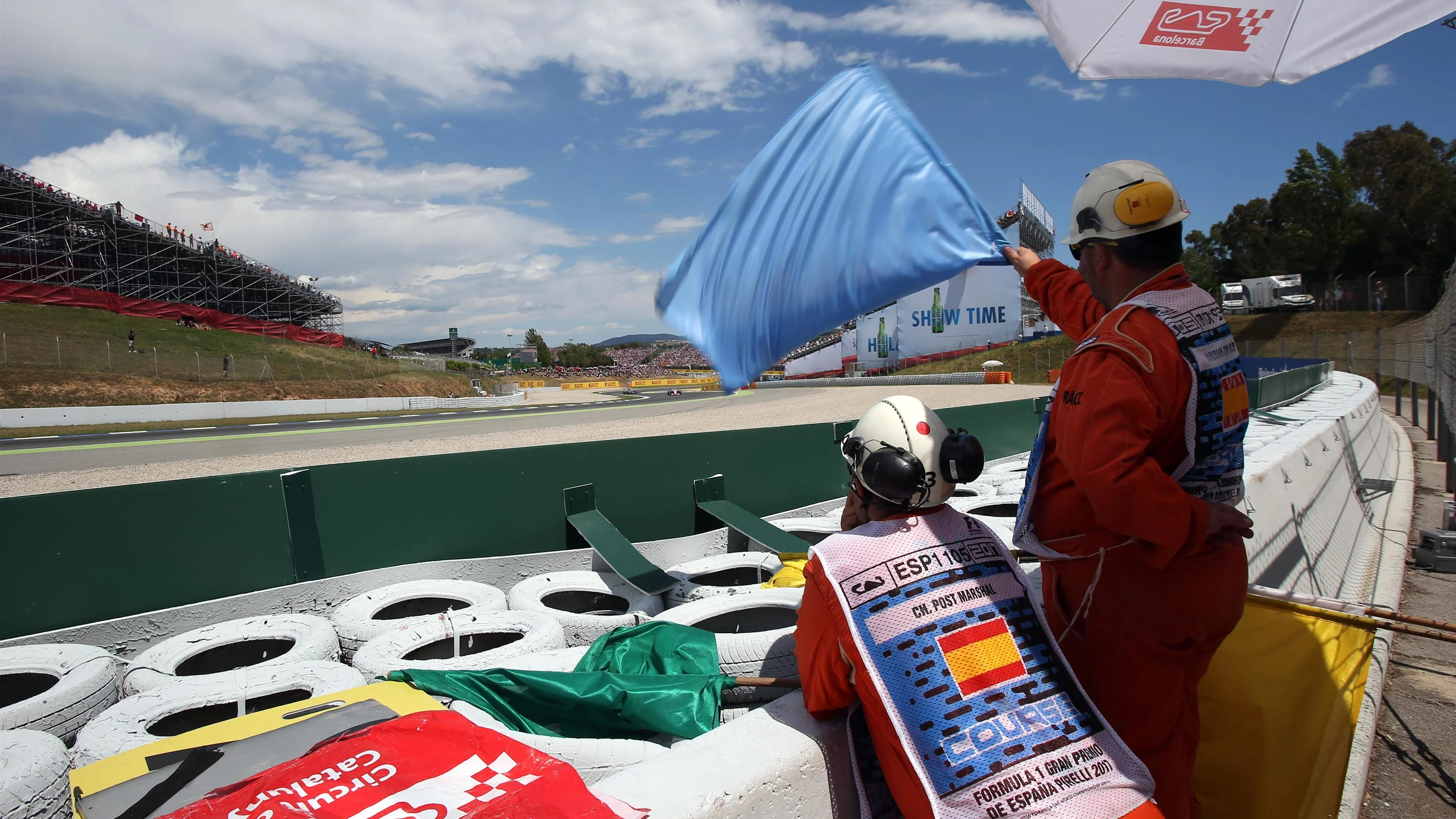 Marshals wave the blue flag at Formula One World Championship, Rd5, Spanish Grand Prix, Race, Barcelona, Spain, Sunday 14 May 2017.