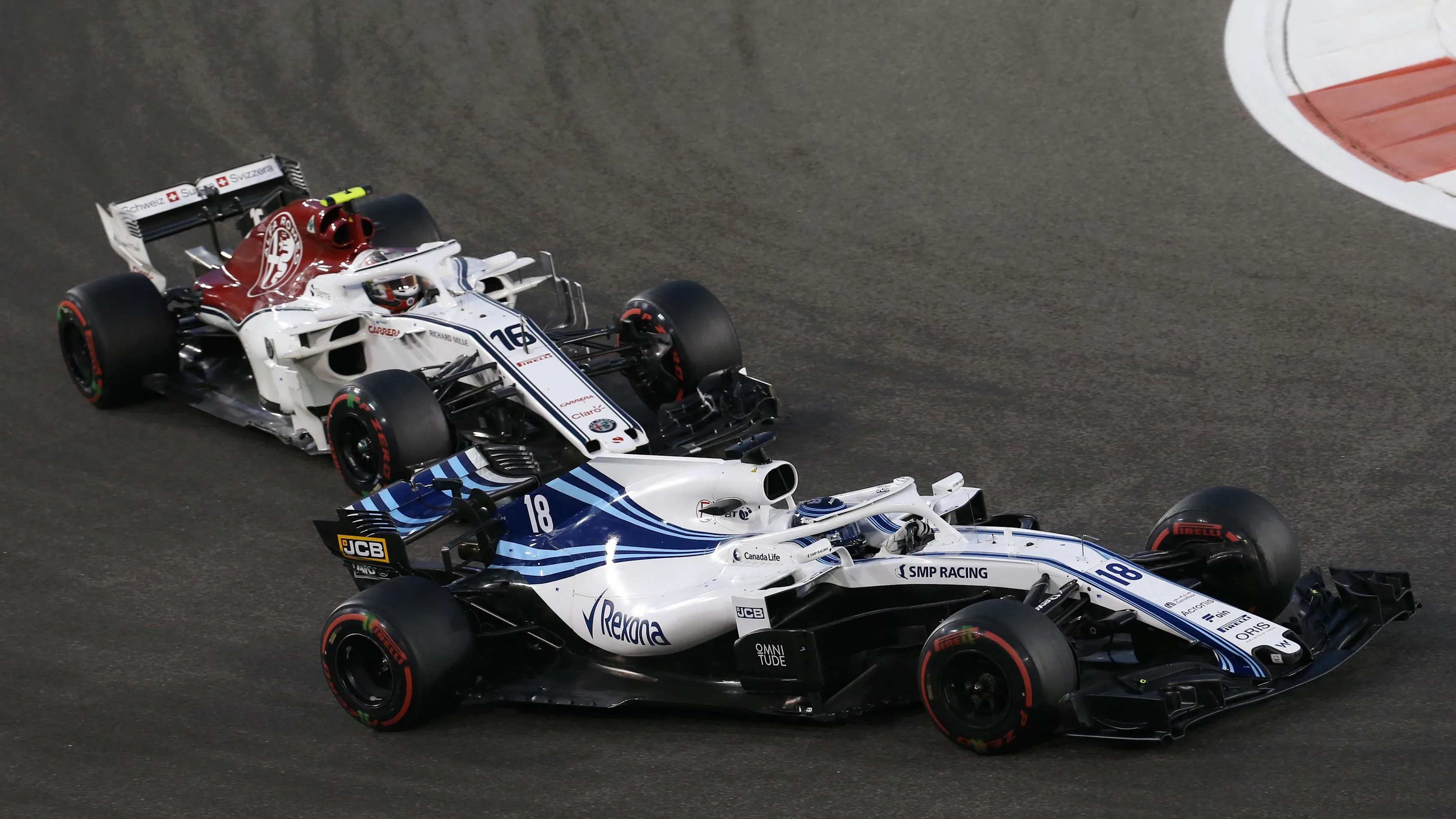 Lance Stroll, Williams FW41 and Charles Leclerc, Alfa Romeo Sauber C37 battle at Formula One World Championship, Rd21, Abu Dhabi Grand Prix, Race, Yas Marina Circuit, Abu Dhabi, UAE, Sunday 25 November 2018.