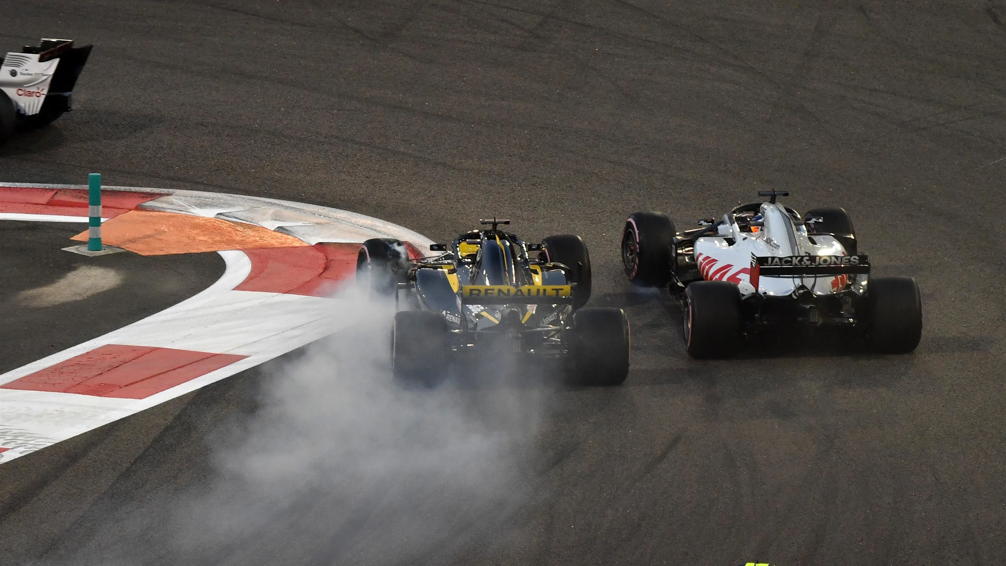 Nico Hulkenberg, Renault Sport F1 Team R.S. 18 and Romain Grosjean, Haas F1 Team VF-18 battle on lap one at Formula One World Championship, Rd21, Abu Dhabi Grand Prix, Race, Yas Marina Circuit, Abu Dhabi, UAE, Sunday 25 November 2018.