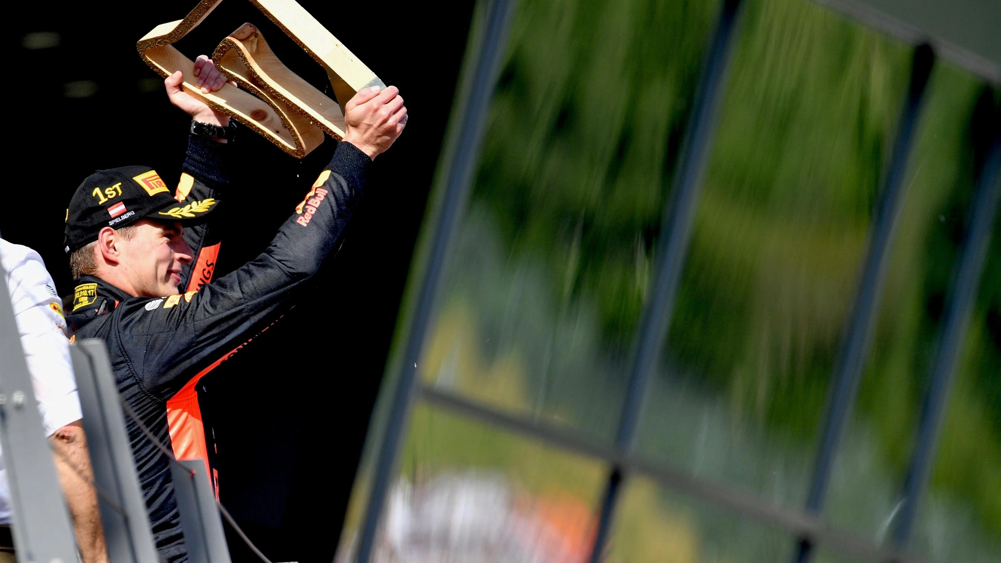 Race winner Max Verstappen (NED) Red Bull Racing celebrates on the podium with the trophy at