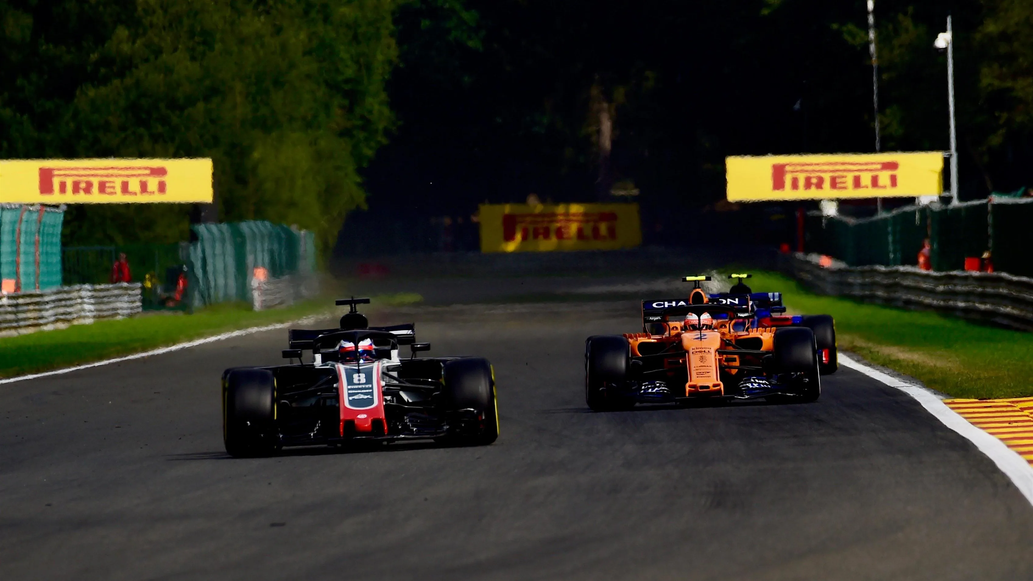 Romain Grosjean, Haas F1 Team VF-18 and Stoffel Vandoorne, McLaren MCL33 at Formula One World