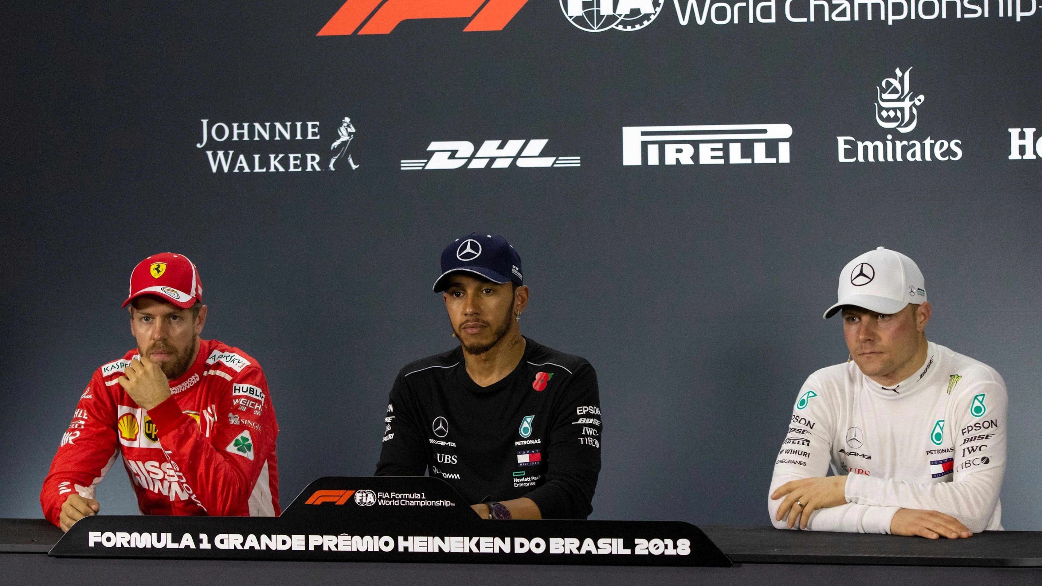 (L to R): Sebastian Vettel, Ferrari, Lewis Hamilton, Mercedes AMG F1 and Valtteri Bottas, Mercedes