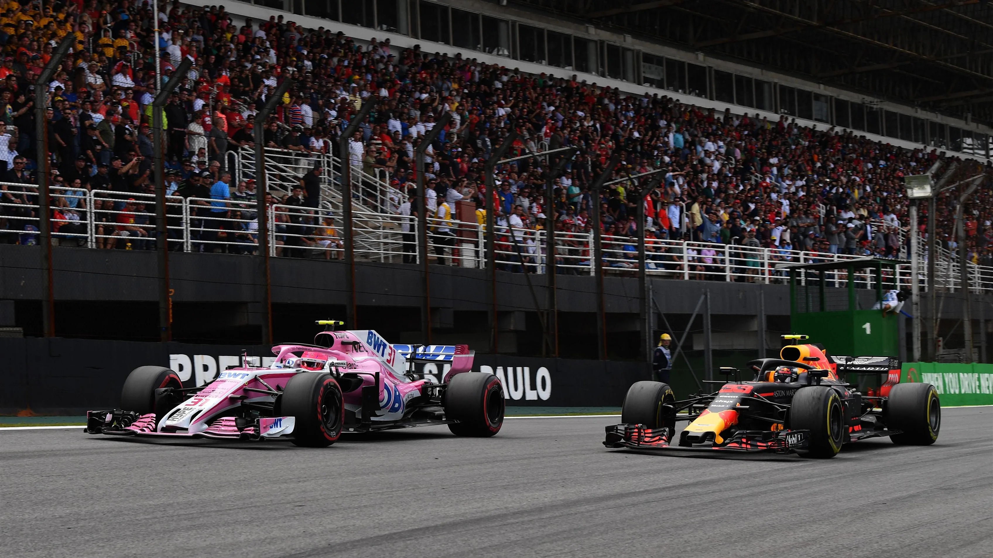 Esteban Ocon, Racing Point Force India VJM11 and Max Verstappen, Red Bull Racing RB14 battle at