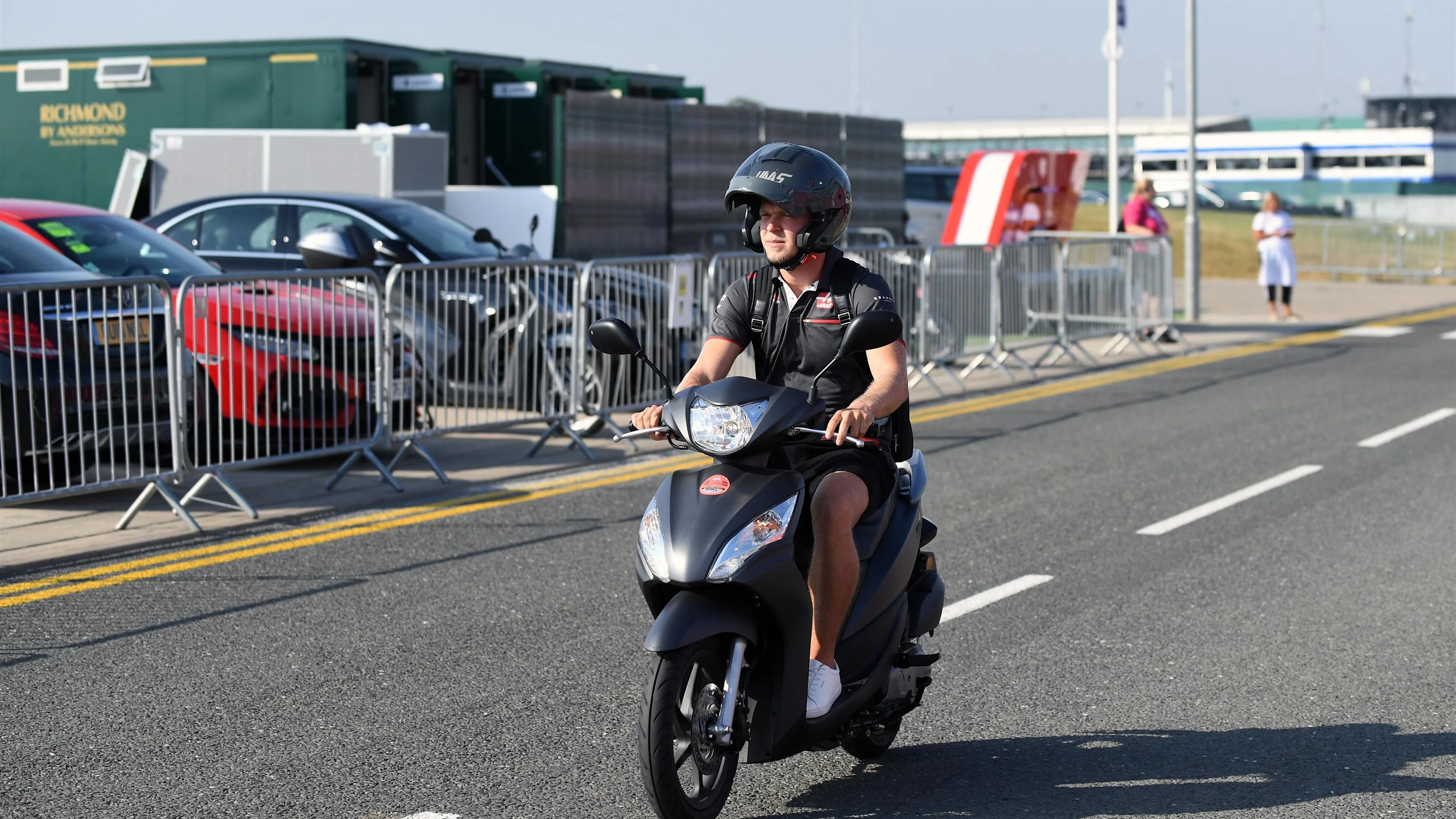 Kevin Magnussen (DEN) Haas F1 on a scooter at Formula One World Championship, Rd10, British Grand Prix, Practice, Silverstone, England, Friday 6 July 2018. © Simon Galloway/Sutton Images