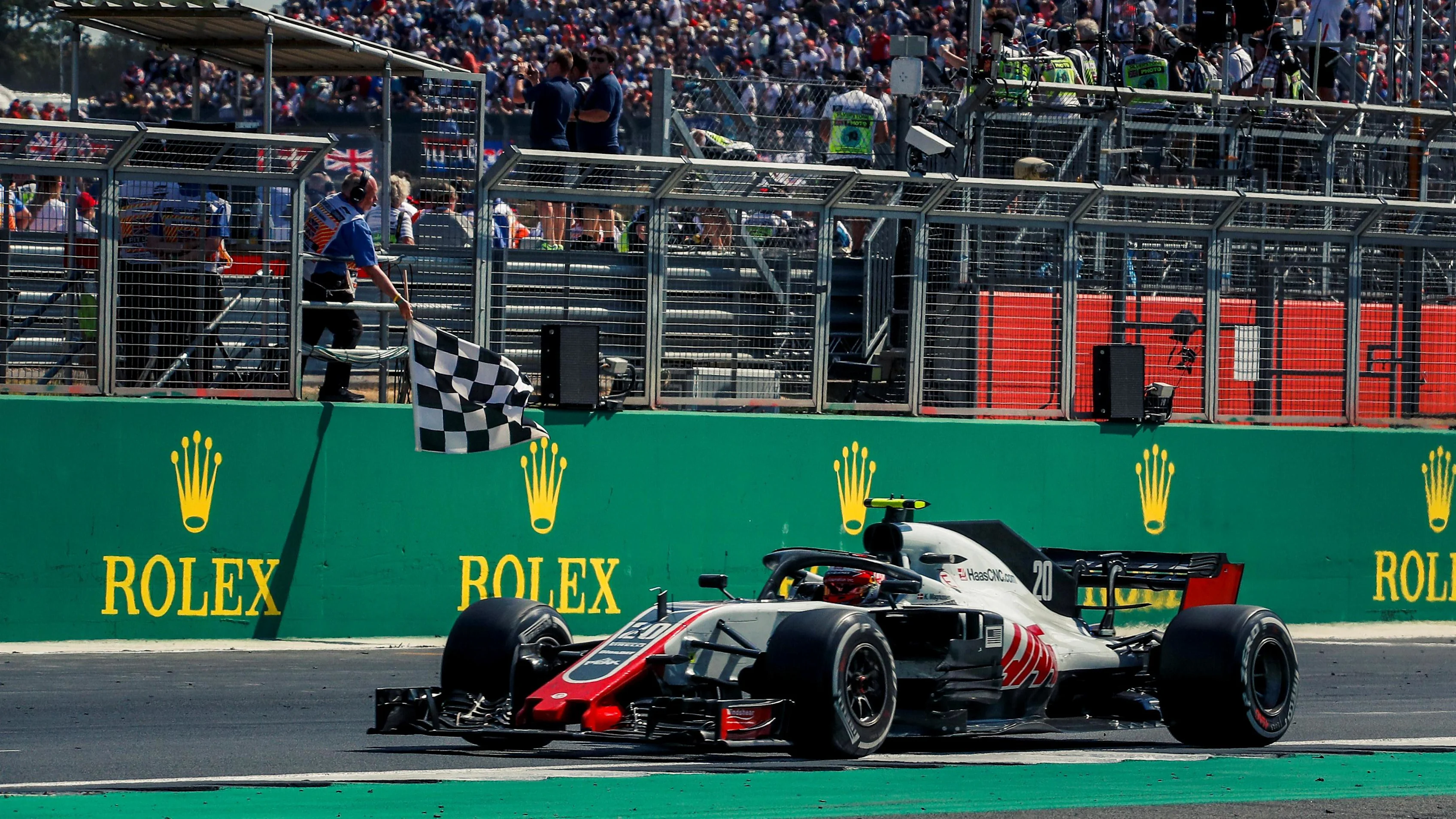Kevin Magnussen (DEN) Haas VF-18 takes the chequered flag at Formula One World Championship, Rd10,