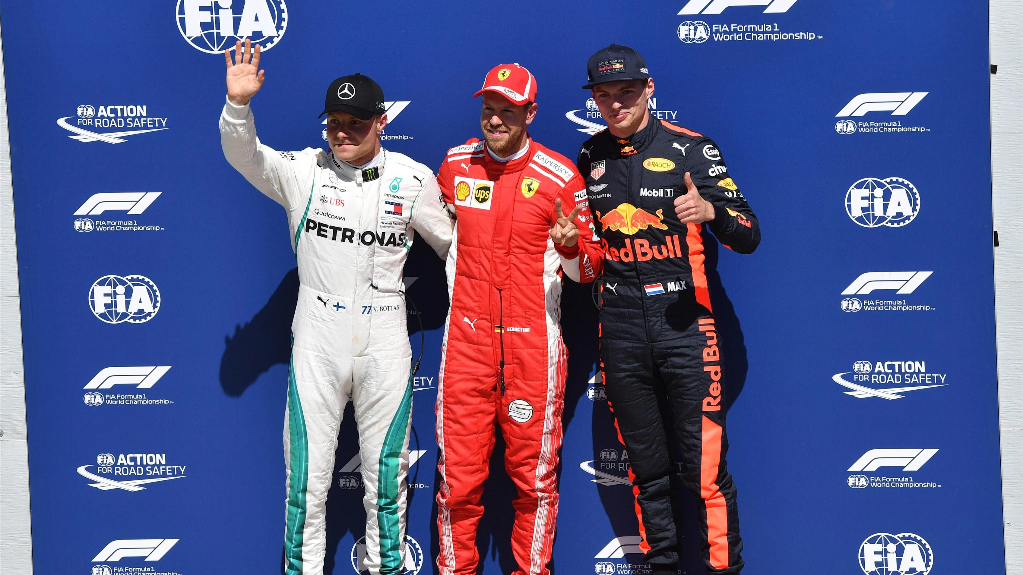 (L to R): Valtteri Bottas (FIN) Mercedes-AMG F1, Sebastian Vettel (GER) Ferrari and Max Verstappen (NED) Red Bull Racing celebrate in parc ferme at Formula One World Championship, Rd7, Canadian Grand Prix, Qualifying, Montreal, Canada, Saturday 9 June 2018. © Jerry Andre/Sutton Images
