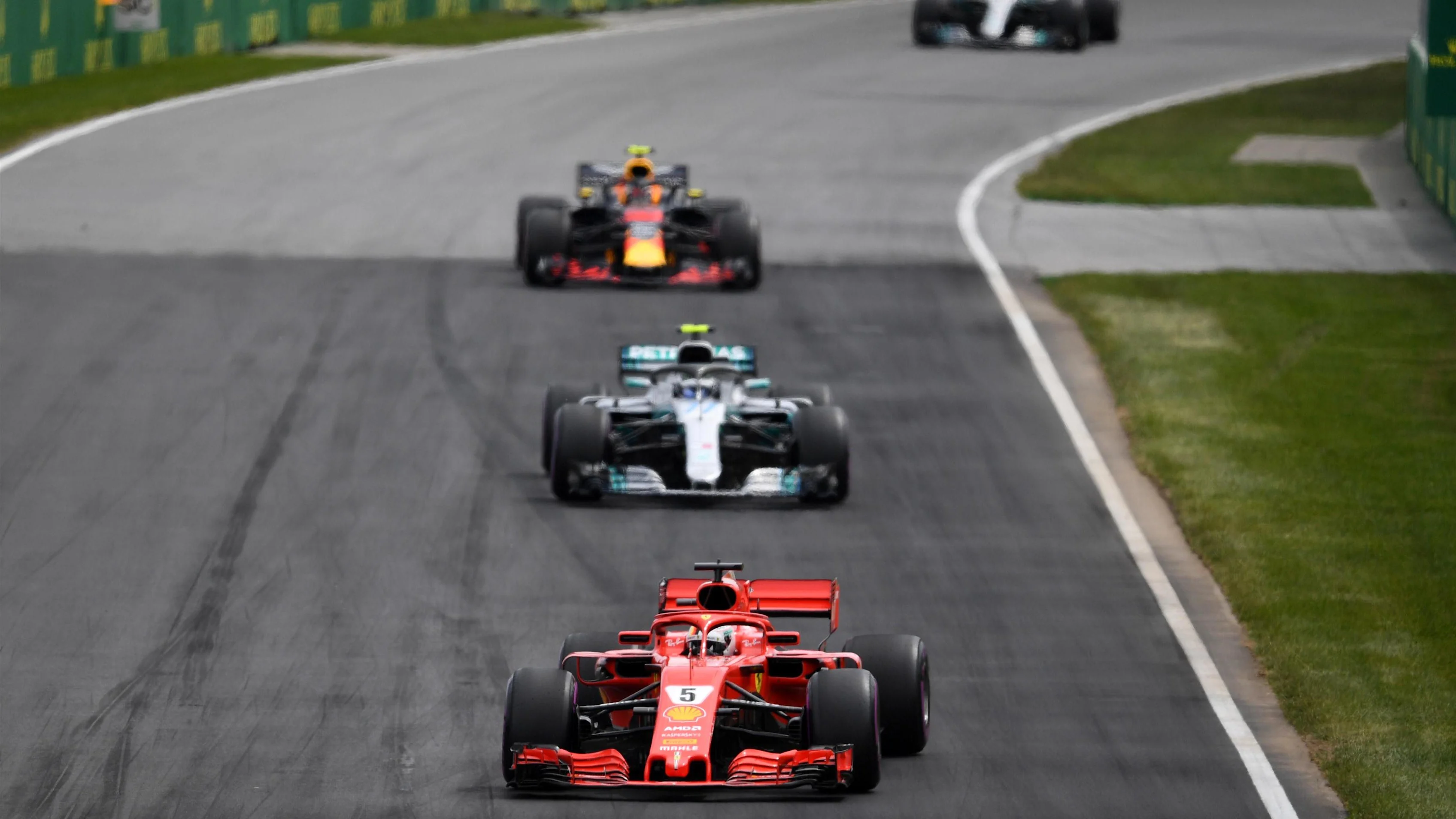 Sebastian Vettel (GER) Ferrari SF-71H leads Valtteri Bottas (FIN) Mercedes-AMG F1 W09 EQ Power+ at