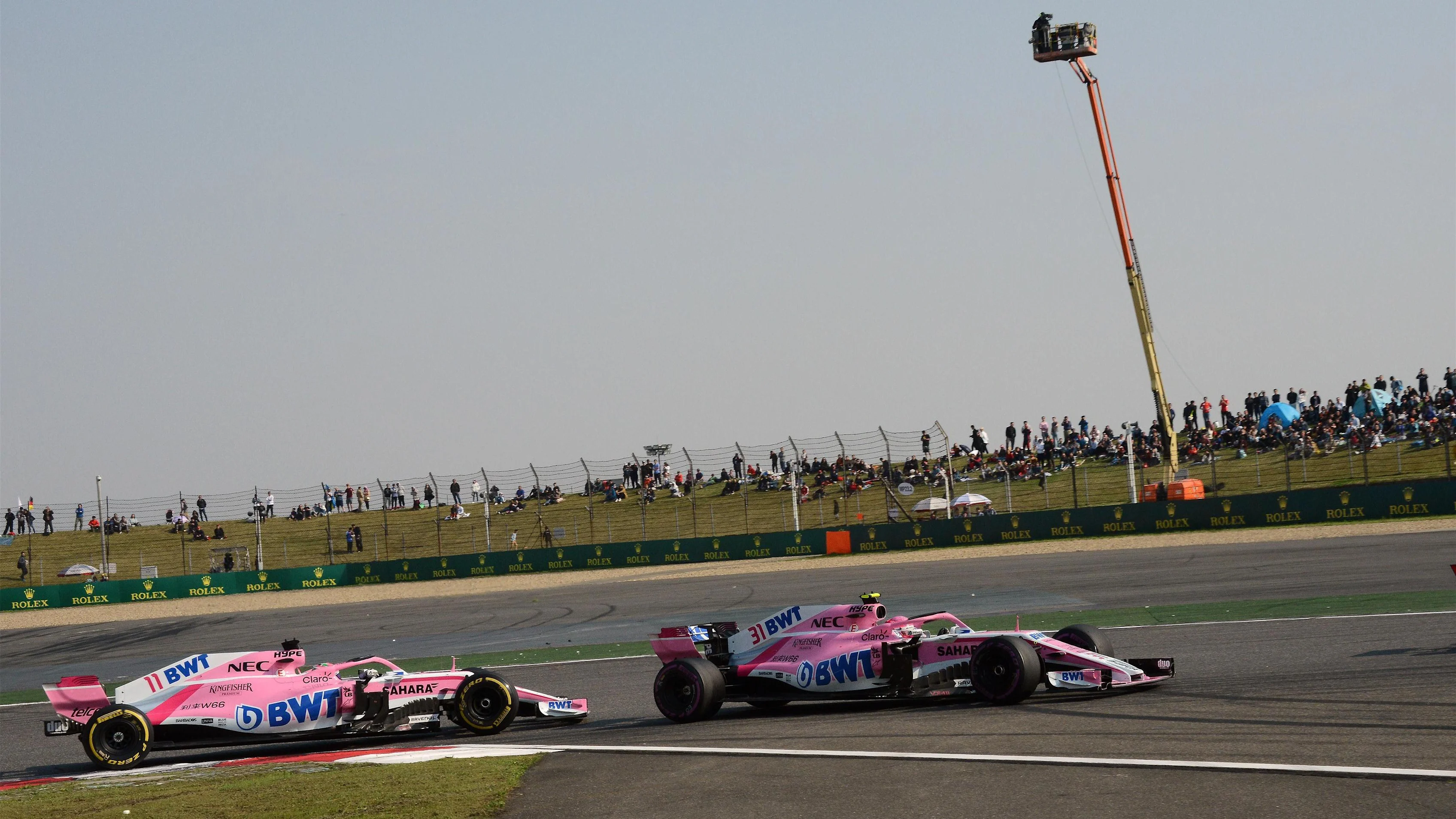 Esteban Ocon (FRA) Force India VJM11 and Sergio Perez (MEX) Force India VJM11 at Formula One World